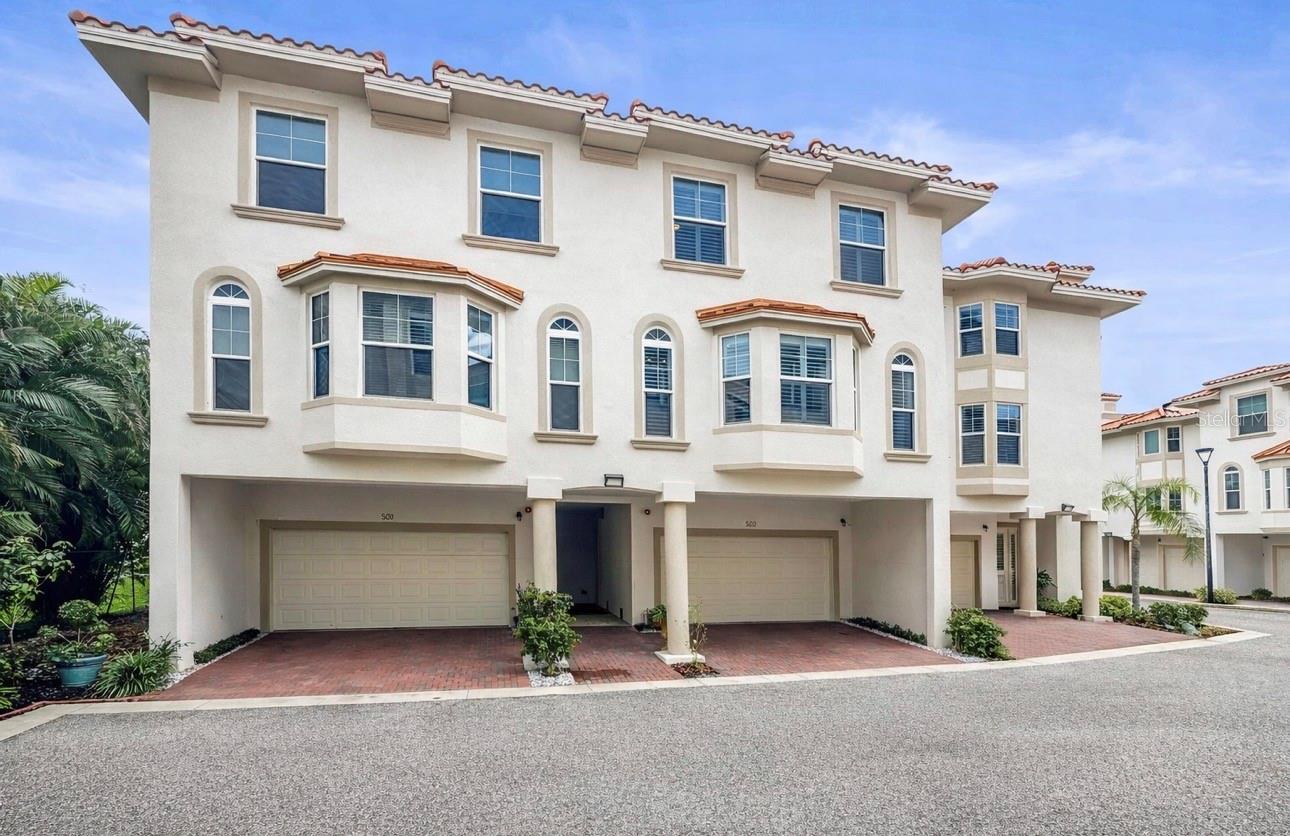 Welcome to San Ruffino Phase II, an elegant three-story luxury townhome offering 3 bedrooms, 2.5 bathrooms, an in-home elevator, and just under 2,400 square feet of beautifully designed living space, located within one of Downtown Dunedin’s most exclusive waterfront gated communities. With only 28 residences in the entire neighborhood, opportunities to own here are exceptionally rare. Completed in 2023 and built to Miami-Dade hurricane standards, this exceptional home blends quality construction, refined finishes, and effortless coastal living.

From the moment you arrive, the home makes a lasting impression. Concrete block construction, hurricane-impact windows and doors, and a timeless clay tile roof provide both durability and peace of mind, while the private walk-up entrance and spacious two-car garage offer the feel of a single-family home. The convenience of an in-home elevator connecting all three levels ensures comfortable and accessible living.

Step inside and discover a home where every detail has been thoughtfully elevated. French oak wood flooring, custom plantation shutters, elegant metal banisters, and a striking stone accent wall create a sophisticated yet inviting atmosphere. The entry patio has been beautifully tiled to match the foyer, and the home features custom built-ins, finished bedroom closets, and a fully upgraded pantry complete with built-in storage and a handmade pot rack. Phantom retractable screens on both verandas allow you to enjoy the fresh coastal breeze while maintaining privacy and comfort.

At the center of the home is a gourmet chef’s kitchen designed for both entertaining and everyday living. Featuring quartz countertops, solid wood cabinetry, and premium Fulgor Milano appliances, including a state-of-the-art induction cooktop, refrigerator, dishwasher, and microwave, the space delivers both beauty and top-tier performance. Quartz finishes continue throughout the bathrooms, while low-energy lighting enhances the home’s modern efficiency.

Beyond the walls of the home lies a lifestyle few communities can offer. San Ruffino residents enjoy resort-style waterfront amenities, including a sparkling pool, hot tub, fishing dock, and kayak and paddleboard launch. Just steps away, the Pinellas Trail provides access to more than 75 miles of scenic biking and walking paths, while the shops, restaurants, breweries, marina, and year-round festivals of Downtown Dunedin are only an eight-minute walk away.

With both eastern and western exposures, the home is filled with natural light throughout the day. Adjacent to the property is the peaceful Wilson Street waterfront park, shaded by majestic oak trees and offering tranquil green space along the water.

Offering more space and privacy than a traditional condominium with far less maintenance than a single-family home, this residence is ideal as a full-time home, seasonal retreat, or lock-and-leave coastal getaway. The HOA includes waterfront living insurance, providing additional value and peace of mind!

San Ruffino Phase II represents the perfect blend of luxury, lifestyle, and location—an exceptional opportunity to experience waterfront living in one of Dunedin’s most coveted communities. Furniture may be included. Schedule your showing today!