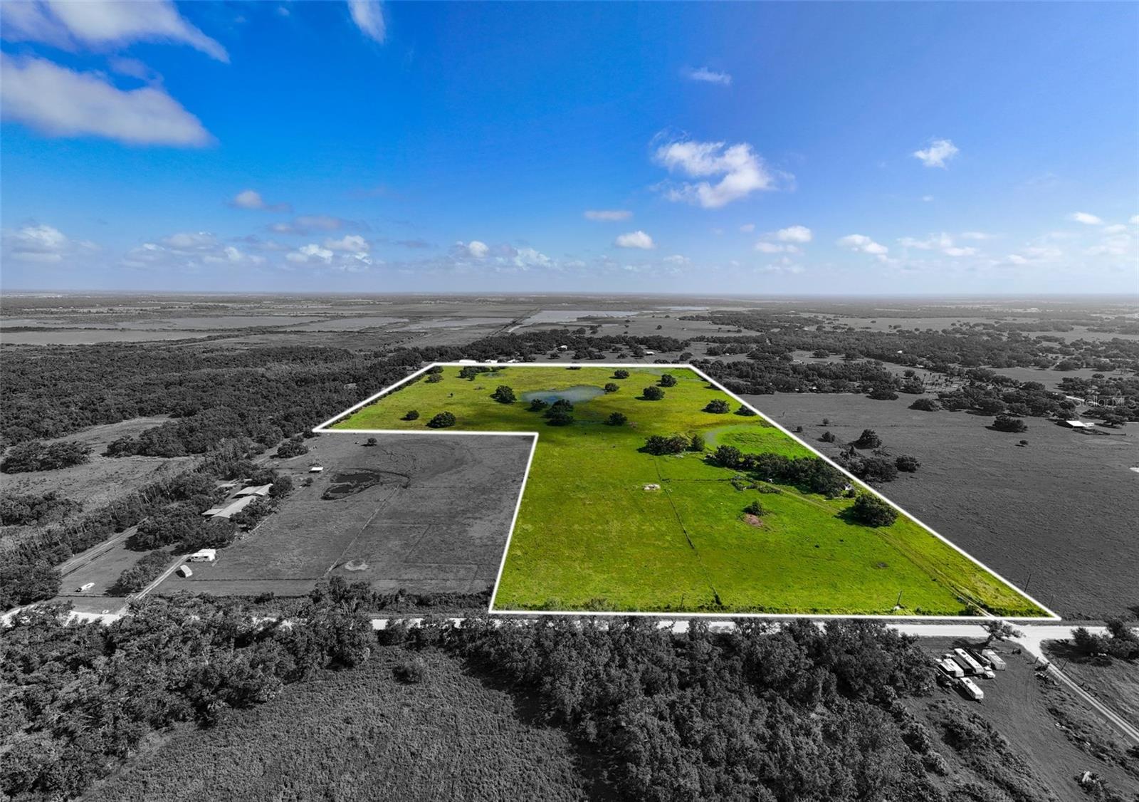 Have you been dreaming of BUILDING a custom home on vacant land? Discover 47 acres of buildable agricultural land nestled at the end of scenic River Road in Myakka City, just moments from the new Soleta Golf Club and within a 20 minute drive to the vibrant community of Lakewood Ranch. There is a 1,000 sq ft home currently on the property but is in bad condition and needs complete renovation or removal. This property is also being marketed as vacant land. Currently the property has a cattle lease that may convey to the new owner and is a benefit for agricultural tax exemptions. The land is well-suited for any agricultural use while offering incredible potential for future development. With no HOA or deed restrictions, you have the freedom to build your dream homestead—whether that’s a custom farmhouse, a modern barndominium, or a fully equipped workshop. There are 2 existing wells and power already in place so construction costs will be eased. The property allows for a primary residence and up to three accessory dwelling units (ADUs), or alternatively it can be subdivided to suit your plans. Mineral rights convey with the sale, and while the majority of the land lies in Flood Zone X (high & dry), there are three small areas of wetlands that provide a seasonal water source for livestock. This vacant land offers a rare opportunity to disconnect from the fast pace of city life without sacrificing access to everyday conveniences. The drive to the property winds through old Florida county roads, offering a peaceful and scenic entry that feels like stepping into a simpler time. Plus, with county plans to pave River Road in the future, accessibility and property value are poised to grow. Whether you're looking to establish a working ranch, a private country estate, or a long-term investment, this versatile property is a true blank canvas ready for your vision. If Buyer keeps the cattle lease in place, they could qualify for an agriculture tax exemption, which will lower property taxes.