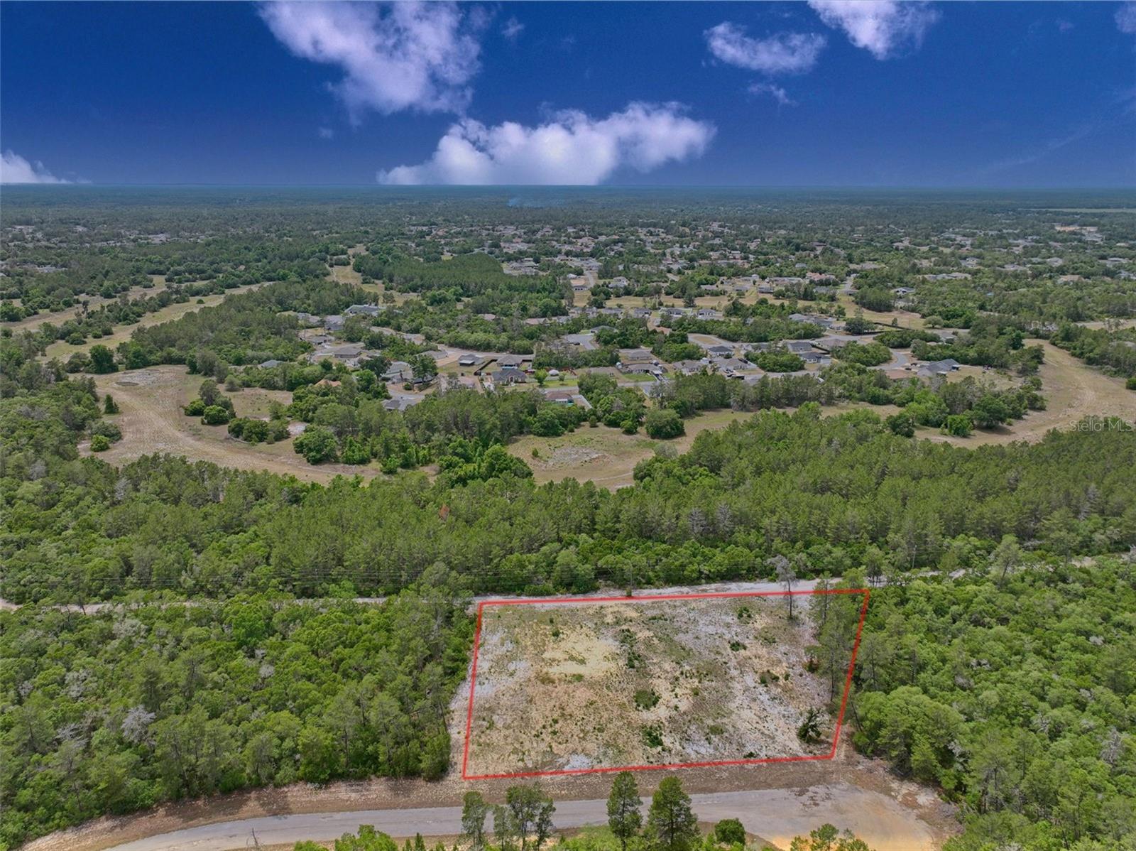 Development opportunity in Marion Oaks offering approximately 1.79 acres with R3 zoning. The property has been previously evaluated for residential development, and prior discussions with Marion County indicate potential for multi-unit development, subject to site plan approval and buyer verification. Public water is located approximately 2,000 feet from the site. Development exceeding six units will require a water main extension. Public sewer is approximately 4,950 feet away; higher-density development may require an onsite wastewater treatment system in accordance with County requirements. Any proposed development is subject to Marion County approval, including but not limited to site plan review, utility requirements, and applicable Land Development Code provisions. Ideal for developers or builders familiar with infrastructure planning and entitlement processes. Buyer to verify all zoning, density, utilities, and development requirements.