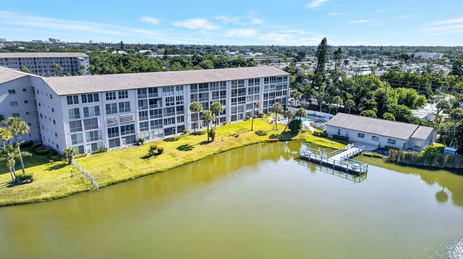 PRICE REDUCTION! Don’t miss this incredible opportunity to own a piece of paradise in the highly sought-after Building P at Lake Bayshore! Welcome to 3344 Lake Bayshore Drive #P205, a beautifully maintained turnkey furnished condo offering breathtaking lake views and an unbeatable Florida lifestyle at an even better value.

From the moment you step inside, you’ll appreciate the light, bright, and inviting atmosphere. The enclosed lanai is the true highlight of the home, overlooking the sparkling heated pool and peaceful lake. Sliding windows allow you to enjoy the fresh Florida breeze year-round, creating the perfect spot for morning coffee, evening cocktails, or simply relaxing while taking in the view.

Luxury vinyl plank flooring flows throughout most of the living areas, offering a modern and low-maintenance touch. The updated guest bath adds stylish appeal, while the newer washer/dryer combo conveniently located on the lanai provides everyday convenience. Whether you're searching for a full-time residence, seasonal retreat, or investment opportunity, this move-in-ready condo checks all the boxes.

Lake Bayshore is a vibrant and active 55+ community known for its friendly atmosphere and exceptional amenities. Residents enjoy a large clubhouse with pool tables, a full kitchen, library, games and puzzles, plus a busy social calendar filled with activities and events. Multiple sundecks provide perfect place to soak up the Florida sunshine and enjoy the resort-style setting.

Located just minutes from Anna Maria Island, Downtown Bradenton, and the scenic Riverwalk, you’ll have easy access to beautiful beaches, dining, shopping, entertainment, and everything the Gulf Coast lifestyle has to give.

With a recent price improvement and one of the best views in the community, now is the perfect time to make this beautiful condo your own!