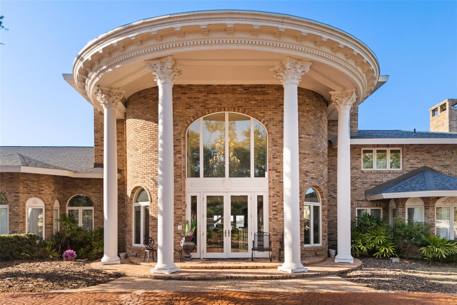 “The Magnificent Grand Mansion”  The Riverfront Estate is an architectural masterpiece on the Manatee River Channel. Breathtaking water views extend the full length of the residence through French doors, sidelights, and arched transoms designed for seamless indoor-outdoor living.  Northern exposure fills the interior with natural light while framing expansive views of the Manatee River and Gulf of America. This custom multi-level mansion offers approx. 12,000 sq ft of interior living space and nearly 14,000 sq ft under roof. Nearly every vantage point captures sweeping waterfront scenery, with each bedroom suite positioned for optimal river and canal views.  The estate includes approx. 202 feet of prime waterfrontage with direct Gulf access within minutes.  Additional upside includes potential to reconfigure four lots into three larger estate parcels for future redevelopment.  Positioned caddy-corner across the Manatee River Channel/Governors Cut from the Bradenton Yacht Club, the estate holds one of the premier locations along the river with direct access north to Tampa Bay.  A newly constructed (2025) 400-foot deep-water pier serves as a private bridge to open waters, featuring a 14x12 platform for fishing, entertaining, or launching kayaks. The dock includes a heavy-duty davit system for vessels up to 35 feet, deep-water frontage of 5.5–6.5 ft accommodating yachts up to 70 feet, plus power, water, lighting, and prep station. Rare potential for seaplane access adds exclusivity.  The grand master suite offers an 1,100 sq ft ground-floor retreat with river-to-Gulf views and wood-burning fireplace, flowing into a 1,000 sq ft spa bath with dual granite vanities, marble floors, and clawfoot tub overlooking the water. Includes dual-head shower, walk-in closets, and laundry hookups.  Originally built in 1973 and renovated in 2009, the estate has been enhanced with modern upgrades including a 2025 roof, chandeliers, 18-inch marble flooring, luxury woodwork, impact windows, updated systems, and multi-zone HVAC.  The open-concept design flows into a 1,900+ sq ft Great Room with sunset views, wet bar, wine fridge, chef’s kitchen, and formal dining. Additional features include four fireplaces, Butler’s Kitchen, oversized laundry, custom cabinetry, and curved staircase to upper-level office overlooking the river.  The second level includes a luxury suite with panoramic views, spa bath, whirlpool tub, walk-in closet, and a 400 sq ft bonus room. Upper levels feature a mezzanine loft and two additional bedroom suites with private baths and water views.  Additional improvements include interior/exterior paint, resurfaced driveway and pool deck, seawall enhancements, and updated electrical and plumbing systems.  Move-in ready, this riverfront estate offers rare redevelopment potential, unmatched waterfront depth, direct Gulf access, and exceptional luxury throughout.  “The Magnificent Grand Mansion” is a once-in-a-generation Gulf Coast waterfront opportunity.

Schedule your private showing before this rare estate is gone.