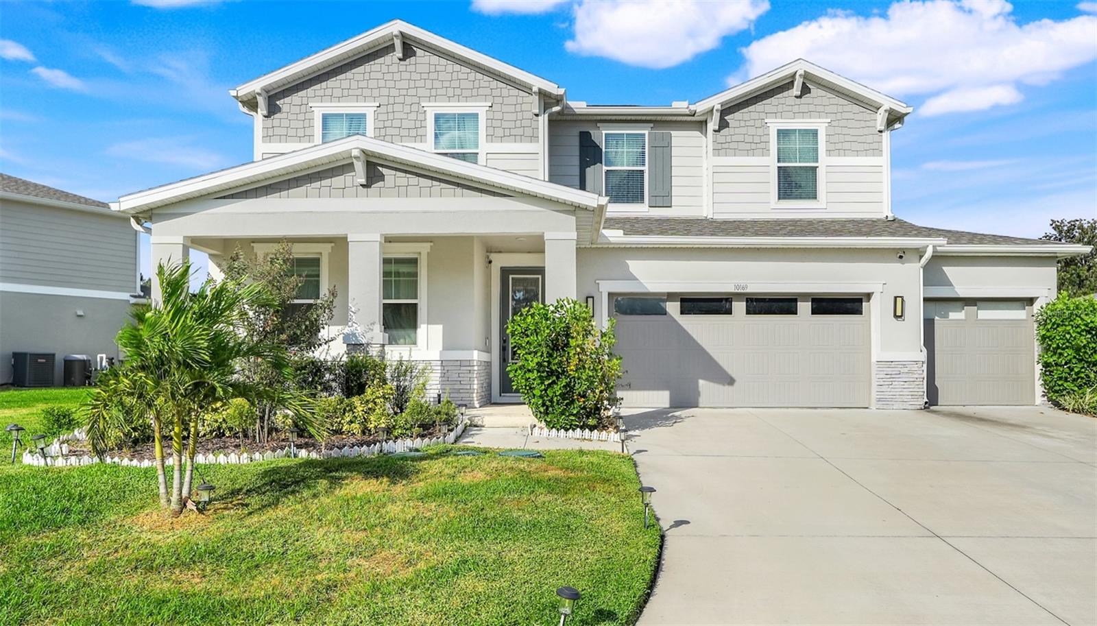 Welcome to this stunning 2023-built, 3,210 sq ft MULTI-GENERATIONAL home located in the highly sought-after Palisades community in Clermont. This thoughtfully designed home offers 4 BEDROOMS, 3.5 BATHROOMS, PLUS 2 BONUS ROOMS, and is perfectly positioned with front-facing POND and CONSERVATION views, a charming front porch, and a peaceful natural setting. Step inside to a bright, open floor plan filled with natural light and modern finishes throughout. The heart of the home is the GOURMET KITCHEN featuring quartz countertops, stainless steel appliances, 42" upper cabinets, a BUTLER’S PANTRY, and a large center island that opens seamlessly to the family and dining areas — ideal for everyday living and entertaining. The home includes a PRIVATE FIRST-FLOOR SUITE with a full bath, perfect for guests, extended family, or a home office. Upstairs, the spacious OWNER’S SUITE offers a spa-inspired bathroom and a large walk-in closet, along with two additional bedrooms (each with walk-in closets), a full bath, an OVERSIZED LOFT (ideal for a home office, gym, media room, flex space, or potential 5th bedroom), and a conveniently located laundry room. Enjoy outdoor living with a covered patio in the backyard — perfect for relaxing or entertaining — and take in serene pond and conservation views from the inviting front porch. Residents of Palisades enjoy RESORT-STYLE AMENITIES including a community pool, clubhouse, tennis, pickleball and basketball courts, lakefront playground, private boat ramp with access to Lake Minneola, golf cart trails, boating, fishing, and picnic areas. HOA dues include fiber-optic internet and basic cable. Conveniently located just minutes from Historic Downtown Clermont, AdventHealth, shopping, dining, and with easy access to the Florida Turnpike — and an easy drive to Orlando, theme parks, and Florida’s beautiful beaches. This home offers the perfect combination of space, flexibility, privacy, and lifestyle — truly a must-see!