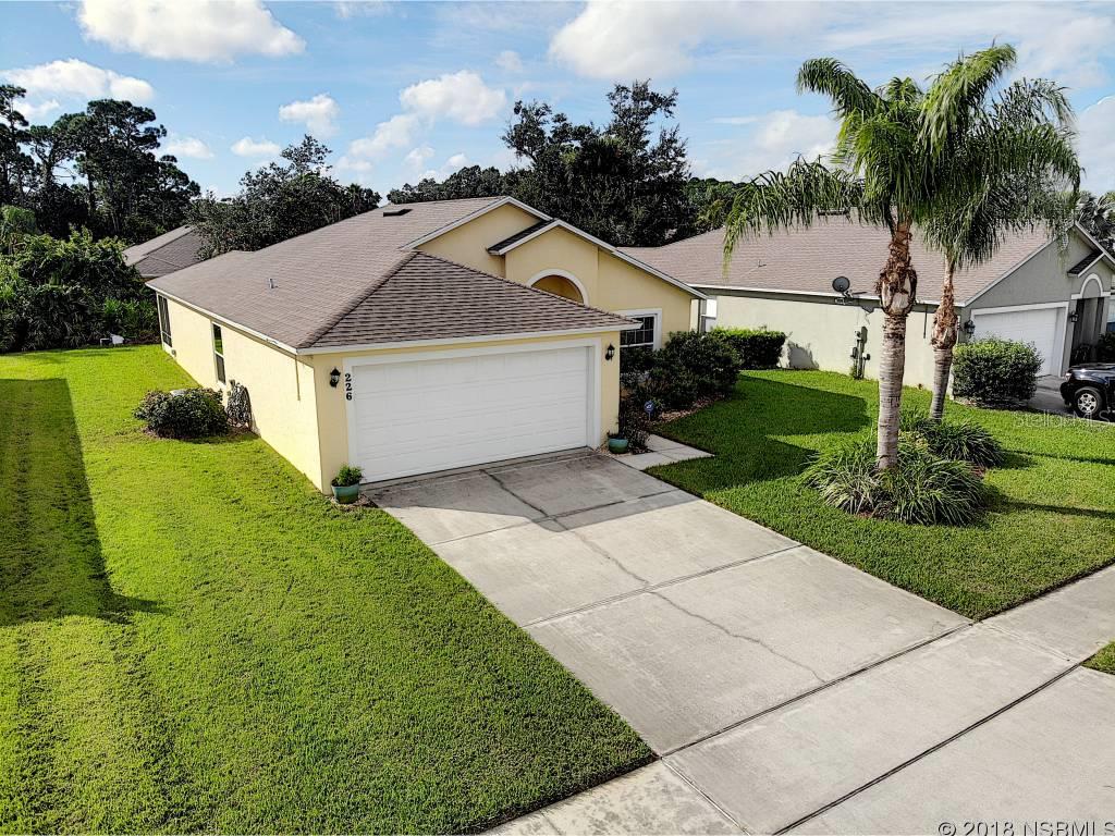 WELCOME HOME! Come and live the Florida lifestyle that you and your family have been dreaming of in this immaculate, like new, family 3 bedroom 2 bath home in the charming Majestic Oaks community in Edgewater Florida. The fantastic open floor plan with fully tiled large eat-in kitchen makes this home perfect for entertaining family, friends, and neighbors. Enjoy your newer SS appliances, vaulted ceilings throughout with updated lighting and ceiling fans making this home move-in ready for you and your family. Relax and enjoy your spacious 15x13 master suite w/ walk-in closet, elegant master bath w/ dual sinks, walk-in shower, & soaker tub.  The split bedroom living plan affords plenty of space for the children, grandkids, or your home office. Your meticulously maintained dream home includes many upgrades, including luxurious Armstrong laminate wood floors, reverse osmosis water system in the kitchen, ADT alarm system, 2 attic storage areas, upgraded insulation, new exterior paint, 1 year new well for sprinklers, and 2017 âNew Southâ Lifetime warranty 140 MPH rated windows and for extra protection and insurance savings, full home hurricane panels. Nature is right outside your door in your tranquil backyard including a fully screened 10x16 porch and custom brick pavered BBQ area for quiet evenings and neighborhood BBQs.  Proximity to shopping and restaurants compliment this quaint community with room to walk the pets, exercise, or mingle with your friendly neighbors.LOOK NO MORE, BECAUSE YOU HAVE FOUND YOUR DREAM HOME AT 226 TREE BRANCH IN MAJESTIC OAKS. ;Water: City