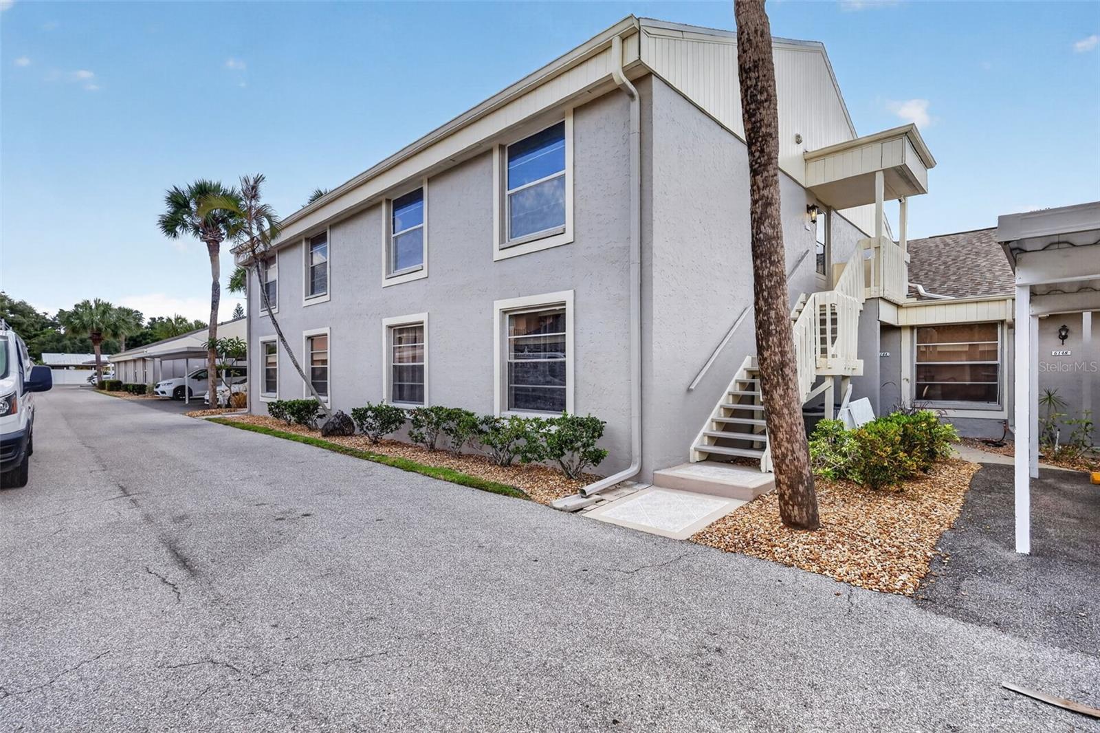 Pebble Springs is a non-age-restricted condo community with a great West Bradenton location. WALK TO public transportation, Fresh Market, restaurants, banks, Bealls department store, and much more. GT Bray park is nearby. Gulf beaches are a few miles west on Manatee Ave to Gulf Drive! This 2nd floor unit is very bright and cheerful. Upstairs offers security, privacy, and beautiful views of the courtyard and pool from screened lanai. Clean 2BR 2BA with several updates. NEW ROOF 2025, kitchen and guest bath remodeled in 2017. AC and Hot water tank in 2014. Primary bedroom has an en-suite bath with a walk-in shower. Indoor laundry closet with a stack washer/dryer in hallway. Kitchen has a pass-thru to dining room. Community roads paved in 2019. CARPORT conveniently located near unit. Additional guest parking available. Clubhouse and pools. Call today to schedule your appointment to preview this move-in ready unit.