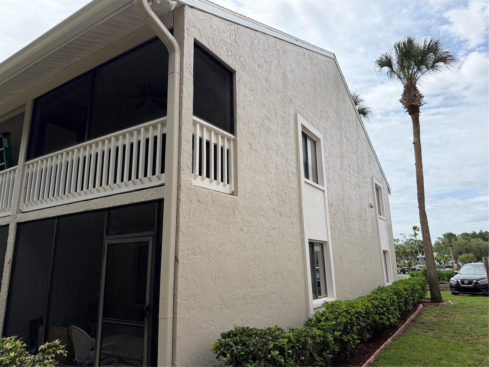 Desirable screen enclosed end unit condo close to lake, dock and fishing pier. This condo’s kitchen was recently remodeled with grey kitchen cabinets, a built-in pantry, wall to wall tiles and backsplash. Upgraded stainless appliances. The bathroom vanity has been replaced. High cathedral ceiling in living room and bedroom. Mirrored accent wall in living/dining area and bedroom also has a mirrored accent wall from floor to ceiling. A utility closet has a stackable washer and dryer and a tankless water heater. End units have two extra windows. There is a loft over the kitchen and bathroom area that provides extra storage. The condo has tiled ceramic plank flooring throughout. There are three ceiling fans including one on the screened front porch measuring 12’x6’. The screen enclosure overlooks the large, picturesque cypress trees. Condo is in immediate proximity of three sun and fun areas with patio furnishings for residences to enjoy.  Plenty of open parking and golf cart parking. With paid membership to Paradise residences can utilize the nightclub, Key West Bar, restaurant, water volleyball pools. Hot tub, heated pool, pickle ball courts and more. This condo is situated in a world renown nudist community.  Paradise is within a short distance to restaurants, shopping and medical facilities. Less than 30 minutes to TPA International Airport.