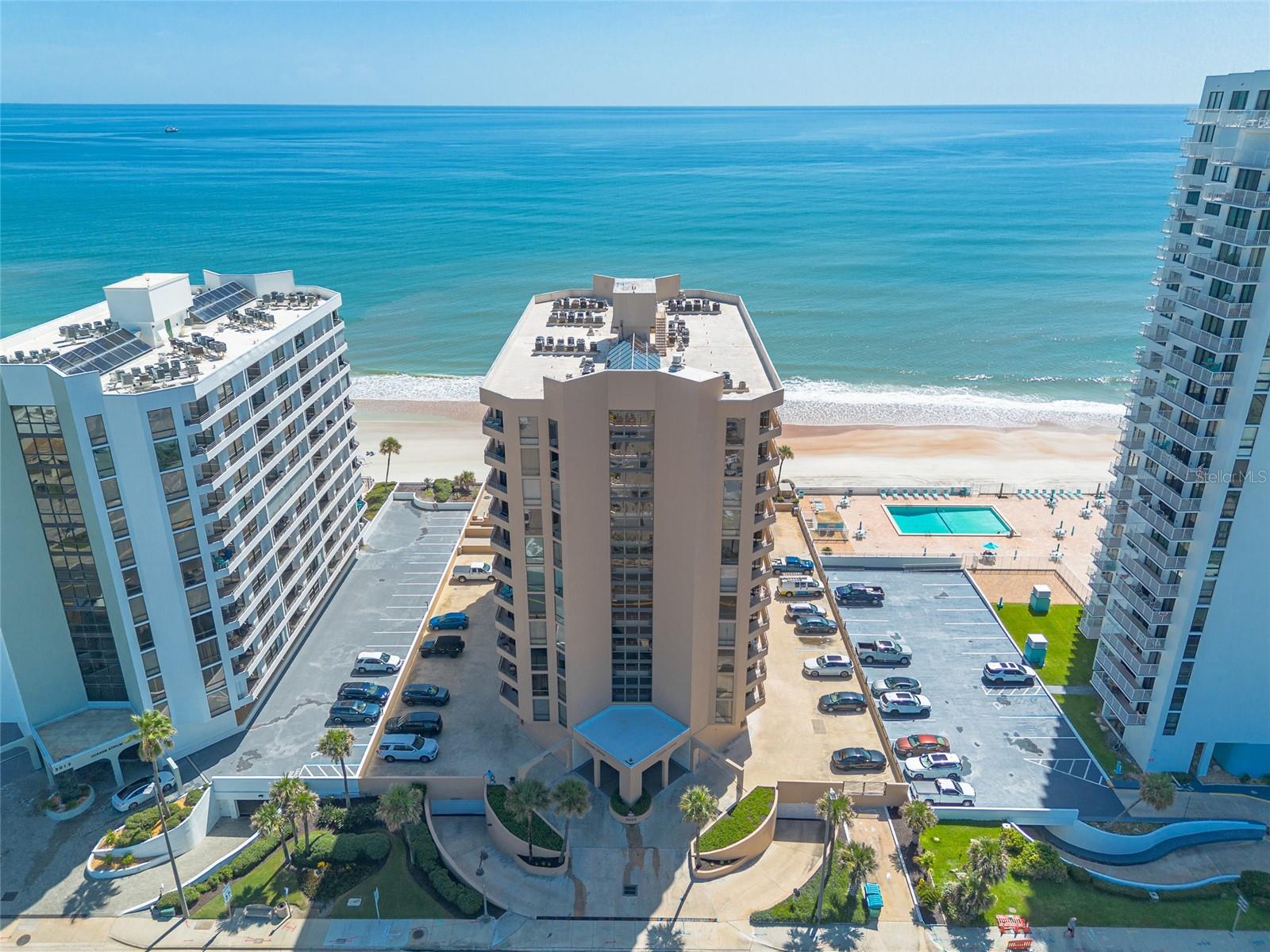 Wake up to breathtaking ocean sunrises and unwind with spectacular sunsets over the Intracoastal from this beautifully updated, fully furnished 9th-floor corner condominium in the highly desirable Ocean Atrium. Offering the best of both worlds, this 1-bedroom, 1.5-bath residence is surrounded by floor-to-ceiling windows that fill the home with natural light while showcasing spectacular views of the Atlantic Ocean and the stunning Intracoastal Waterway, a truly unforgettable intracoastal panorama. This move-in ready condo featuring a completely updated kitchen is sure to impress with custom gray shaker cabinetry, beautiful quartz countertops, stainless steel appliances, a large undermount sink, updated faucet, and new garbage disposal. The spacious floor plan offers a generous living room, dining area, convenient laundry closet, and a large primary suite featuring abundant closet space, an ensuite bath, and private balcony access. The balcony can also be accessed from the living room, creating the perfect place to enjoy your morning coffee or evening sunsets. Being offered fully furnished as shown, this move-in-ready condo includes a brand-new bedroom set, dinette with wine rack, washer/dryer combo, and updated quartz countertop, undermount sink, and faucet in the half bath, making it easy to start enjoying the coastal lifestyle from day one. The Ocean Atrium offers resort-style living with an impressive list of amenities, including direct beach access, an oceanfront outdoor pool, heated indoor pool, indoor hot tub, fitness center, saunas, library, social room with a full kitchen, a spectacular 12-story atrium with a cascading waterfall, professional on-site management, and one assigned underground parking space. The HOA fee includes high-speed internet, cable TV, water, sewer, trash, and common area maintenance for added convenience. This community is pet-friendly, so your four-legged companion is welcome too! Ideally located in the heart of Daytona Beach Shores, you're just across the street from Publix, Walgreens, the Community Center, tennis and pickleball courts, golf, a dog park, and a variety of popular restaurants. Meticulously maintained and thoughtfully updated, this exceptional property is perfect as a primary residence, vacation getaway, or investment opportunity. Don't miss your chance to own one of the best values in upscale Daytona Beach Shores! All information deemed to be accurate but cannot be guaranteed.