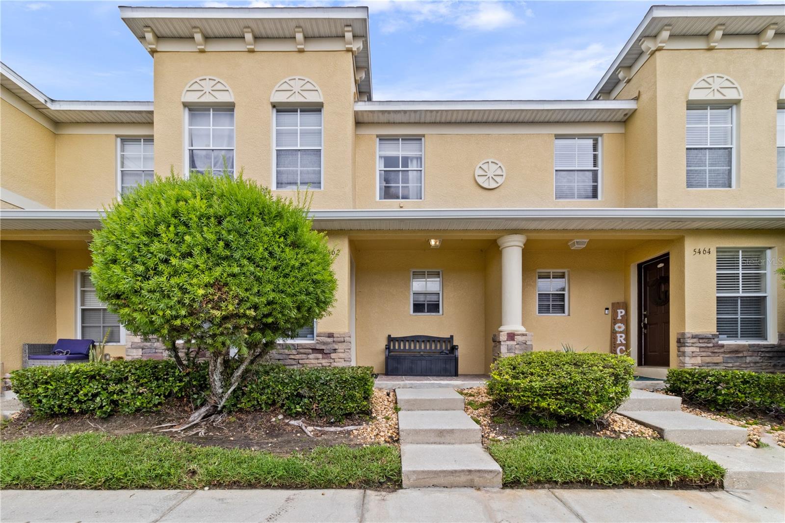 Welcome home to Cobblestone Landing, a conveniently located North Lakeland townhome community offering a low-maintenance lifestyle. This 2-bedroom, 2.5-bath residence with flex room features a functional floor plan with comfortable living spaces and several recent updates.

The first floor offers an inviting entry, spacious living and dining area with tile flooring, a cozy kitchen, convenient indoor laundry, and a half bath downstairs for guests. Enjoy the screened rear porch overlooking the backyard, complete with an exterior storage closet.

A decorative metal railing staircase leads upstairs to 2 bedrooms, 2 full baths, and a flex space upstairs. The spacious primary suite provides ample room to relax, while the additional bedroom and versatile office/den offer flexibility for guests, remote work, hobbies, or additional living space.

Recent improvements include a new A/C system installed in 2024 and a major appliance (refrigerator, dishwasher, range and microwave) replaced in 2023. Tile replaced 2022. The building roof was also recently replaced last year by the association.  Comes complete with one assigned parking space. Guest parking available. 

Residents enjoy access to the community pool, maintained grounds, and exterior maintenance provided through the association. Conveniently located near shopping, dining, medical facilities, and I-4, this home offers easy access throughout Central Florida.

Whether you're looking for a primary residence, seasonal retreat, or investment opportunity, this well-maintained townhome is ready for its next owner.