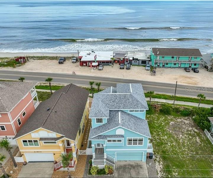 Airbnb ACTIVE SHORT TERM RENTAL PERMIT! Coastal Investment Opportunity in Flagler Beach

Welcome to your dream beachside escape in the charming golf cart-friendly town of Flagler Beach! This beautifully updated 4-bedroom, 3.5-bath concrete block home offers the perfect blend of luxury coastal living and proven income potential with an active short-term rental permit already in place listed on Airbnb and vacation rentals.

Ideally located directly across historic State Road A1A from the beach, this spacious open-concept home features breathtaking ocean views, abundant natural light, and plenty of room for large vacation groups or multi-generational living. Whether you’re searching for a profitable investment property, second home, or full-time beach retreat, this property checks every box.

Vacationers and homeowners alike will love being within walking distance to a beloved local restaurant, scenic parks, and outdoor adventures. Nearby Gamble Rogers Memorial State Recreation Area offers hiking trails, kayaking, canoeing, fishing, and unforgettable natural beauty right at your doorstep.

Located near the end of a quiet dead-end street, this home provides added privacy while still being just a golf cart ride away from downtown Flagler Beach’s shops, restaurants, entertainment, and beachfront atmosphere.

Property Highlights:

Active Airbnb / short-term rental permit
Income-producing investment opportunity
4 Bedrooms | 3.5 Bathrooms
Durable concrete block construction
Beautifully updated interior
Open floor plan ideal for entertaining
Ocean views throughout
Walkable beach access
Golf cart-friendly community
Near parks, fishing, kayaking, and hiking
Quiet dead-end street location
Excellent vacation rental potential

Live the coastal lifestyle while generating income while you're away in one of Florida’s most desirable beach communities!