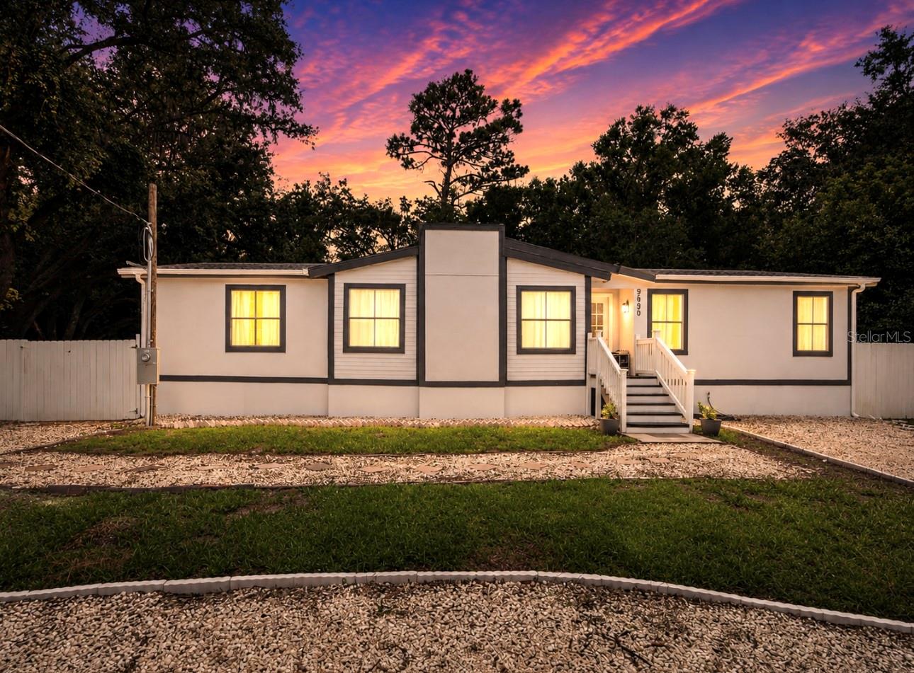 Discover the perfect blend of comfort, flexibility, and future potential with this beautifully remodeled 3-bedroom, 2-bathroom manufactured home in the heart of New Port Richey. Move-in ready and thoughtfully updated, this property offers an exceptional opportunity for homeowners, investors, or anyone looking for room to grow.
What truly sets this property apart is the adjacent vacant lot, owned by the same seller, which is available for purchase separately or together with the home. Create an oversized homesite, build additional outdoor living space, store your RV or boat, add a workshop, or simply enjoy the privacy and extra room that is increasingly difficult to find.
Inside, you'll love the bright open floor plan filled with natural light. The modern kitchen features ample cabinetry, generous counter space, and a breakfast bar that opens seamlessly to the dining area, creating the perfect layout for everyday living and entertaining. The split-bedroom design offers privacy, with a spacious primary suite featuring dual vanities, a walk-in shower, soaking tub, and abundant storage.
Step outside to a peaceful backyard surrounded by mature trees, offering the perfect setting for weekend barbecues, family gatherings, gardening, or simply relaxing while enjoying Florida's beautiful weather.
Conveniently located just minutes from the Ridge Road Extension and Suncoast Parkway, you'll enjoy quick access to Tampa, shopping, restaurants, medical facilities, schools, and the Gulf Coast's beautiful beaches. Outdoor enthusiasts will appreciate nearby Moon Lake Park, offering fishing, kayaking, picnic areas, basketball courts, playgrounds, and scenic walking trails.
NO HOA. NO FLOOD INSURANCE REQUIRED. Whether you're searching for your primary residence, a seasonal retreat, or an investment opportunity, this property delivers outstanding value with room for future possibilities.