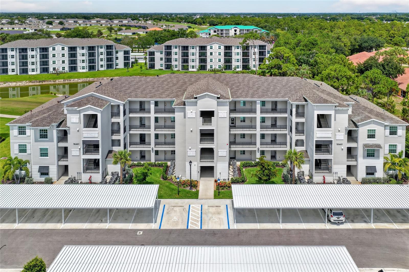 Virtually Staged. GOLF, WATER VIEWS, AND RESORT-STYLE AMENITIES AWAIT! Welcome to this beautifully maintained 2 BEDROOM, 2 BATHROOM CONDOMINIUM located within the gated community of Ibis Landing Golf & Country Club. Offering stunning views of both the golf course and sparkling lake, this second-floor residence combines comfort, convenience, and an active Florida lifestyle in one exceptional package.

One of the standout features of this home is that GOLF MEMBERSHIP IS INCLUDED, allowing residents to enjoy access to the community's championship golf course while taking advantage of the many amenities that make Ibis Landing such a desirable place to call home.

Inside, you'll find a thoughtfully designed open-concept floor plan featuring high ceilings, and abundant natural light throughout the living spaces. The kitchen is well-appointed with quartz countertops, stainless steel appliances, ample cabinetry, pantry storage, and a breakfast bar that opens seamlessly to the dining and living areas, making it ideal for both everyday living and entertaining.

The spacious primary suite offers a relaxing retreat with a walk-in closet and a private ensuite bathroom featuring modern finishes, quartz countertops, and a walk-in shower. A comfortable guest bedroom and full guest bathroom provide plenty of space for family and visitors, while the in-unit laundry area adds everyday convenience.

Sliding glass doors lead to a private screened lanai where you can enjoy peaceful views of the lake and golf course while sipping your morning coffee or unwinding at the end of the day. Hurricane-impact windows and sliding doors provide added peace of mind and energy efficiency.

Additional conveniences include covered parking space and a private storage unit, offering extra room for seasonal items, golf equipment, and more.

Residents of Ibis Landing enjoy access to an impressive collection of amenities, including a resort-style swimming pool, fitness center, clubhouse, tennis courts, pickleball courts, walking paths, and social activities. The community's beautifully maintained grounds and planned on-site dining options further enhance the resort-style atmosphere.

Conveniently located near shopping, dining, healthcare facilities, major roadways, and Southwest Florida International Airport, this property offers easy access to everything you need while providing a peaceful retreat to come home to.

Whether you're seeking a seasonal getaway, full-time residence, or investment opportunity, this exceptional condo offers the perfect combination of maintenance-free living, scenic views, and country club amenities.