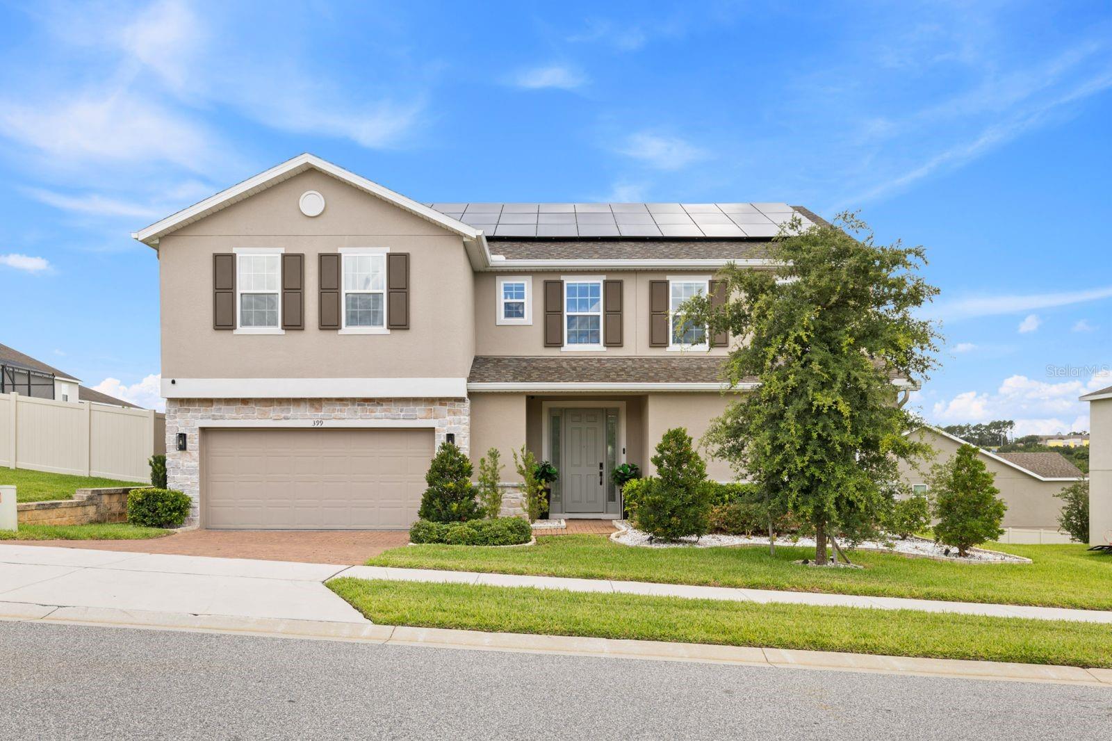Welcome to a STUNNING 2023 CUSTOM BUILD WITH $130K+ IN LUXURY UPGRADES this exceptional 6-bedroom, 4-bathroom modern masterpiece spanning 3,988 square feet of pure elegance! This architect-designed home showcases over $130,000 in premium upgrades, lot premiums, and amazing designer finishes that will take your breath away.

EXPANSIVE PREMIUM LOT & ENDLESS POSSIBILITIES Situated on a sprawling 12,027 sq ft premium lot with incredible potential for your dream outdoor oasis - envision a resort-style pool, relaxing jacuzzi, cozy fire pit, playground, and so much more!

OVERSIZED 3-CAR GARAGE Features premium epoxy flooring for the ultimate in style and durability.

WHOLE-HOME WELLNESS SYSTEMS Complete home water filtration system PLUS alkaline water generator at kitchen sink for the health-conscious family.

CHEF'S DREAM KITCHEN Brand-new 2025 smart appliances including state-of-the-art range, microwave, and dishwasher. Fully appointed smart laundry room with washer and dryer included.

ENTERTAINMENT PARADISE Spacious family room equipped with blackout window treatments - perfect for movie nights and entertaining!

LUXURIOUS PRIMARY SUITE RETREAT Private reading nook, dual walk-in closets with custom built-ins, dual vanity areas, and an incredibly spacious bathroom featuring a soaking tub. Enjoy breathtaking sunset views from your private master suite - the perfect end to every day!

SMART HOME TECHNOLOGY & ENERGY EFFICIENCY

Whole-home surge protection system
Honeywell smart thermostats
Solar system with EXCESS capacity for entire home
PRIME ARDMORE RESERVE LOCATION Just ONE BLOCK from top-rated schools (Elementary, Middle & High School), minutes from Florida Turnpike, brand-new AdventHealth Minneola Hospital, premier shopping, and dining.  

Don't miss this rare opportunity to own a move-in-ready luxury home in one of Minneola's most desirable communities! Schedule your private showing today!