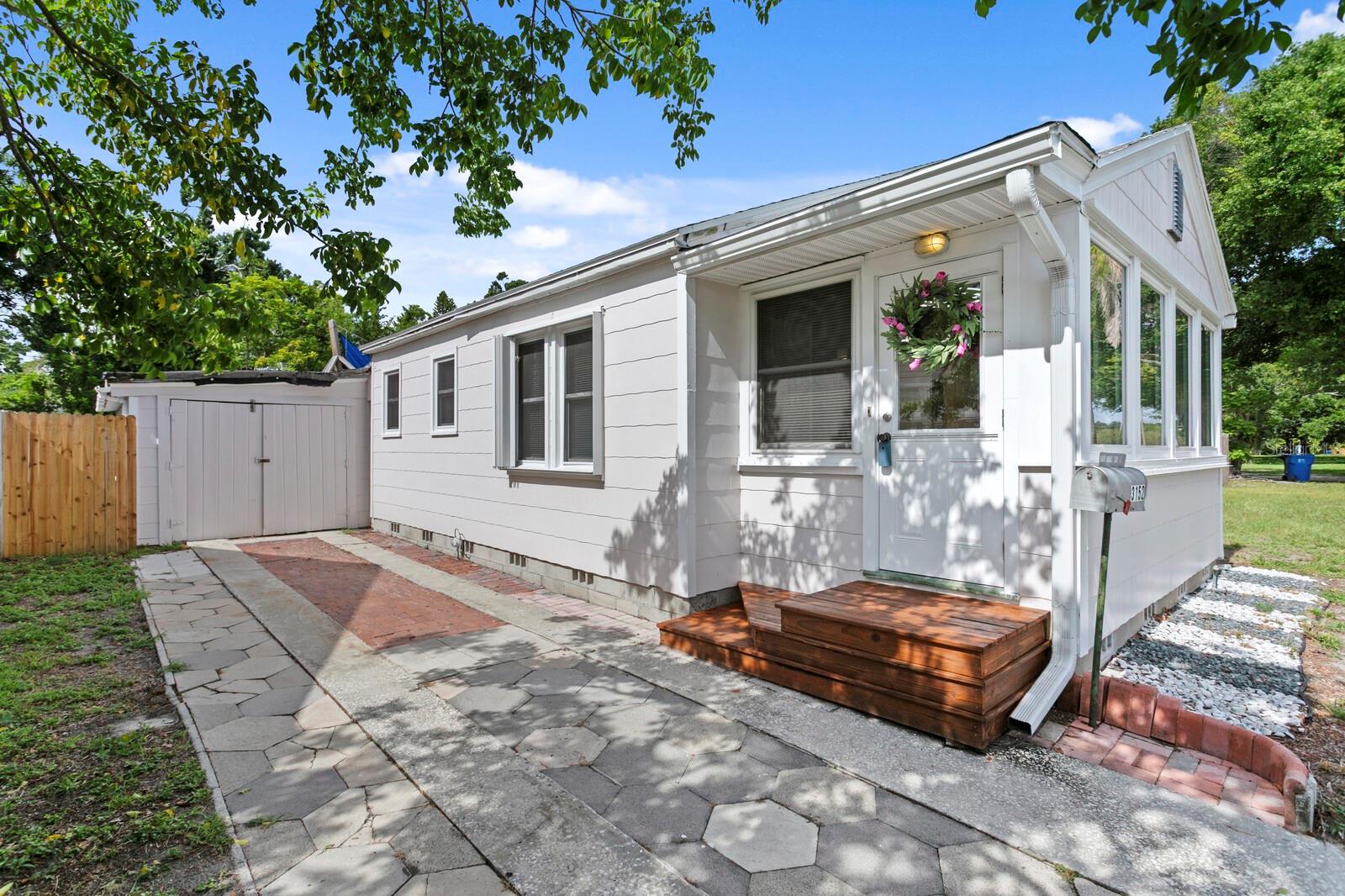 Welcome to your charming single-family oasis at 3152 13th Ave N, St. Petersburg! Located in the sought-after North Kenwood area of St. Petersburg! This cozy 828-square-foot home offers 2 bedrooms and 1 bathroom, perfect for those seeking comfort and functionality. Radiating with a northern exposure, the home is filled with beautiful natural light that accentuates its thoughtful design and warm atmosphere.

Designed with both safety and style in mind, the property features hurricane shutters and window treatments throughout. The windowed bathroom adds a bright, airy feel, while central AC and heating ensure year-round comfort. Thoughtful touches like private storage provide practicality and convenience.

Step outside to enjoy the delightful outdoor amenities, including a private patio and courtyard – ideal for entertaining, relaxing, or soaking in the Florida sunshine. Gather with loved ones around the fire pit, or enjoy cooking outdoors in the dedicated barbecue area. The rain gutters, storm panels, and double-pane windows are functional additions that help keep the property well maintained.


This well-appointed home embodies the perfect blend of charm, comfort, and outdoor living. Conveniently located near St. Petersburg beaches (6.4 miles), Publix, Aldi, and Winn-Dixie grocery stores (within 2.5 miles), Tyrone Mall (5 miles), and Mazzaro's Italian Market (1 mile). This is an opportunity you won’t want to miss. Schedule your private tour today!