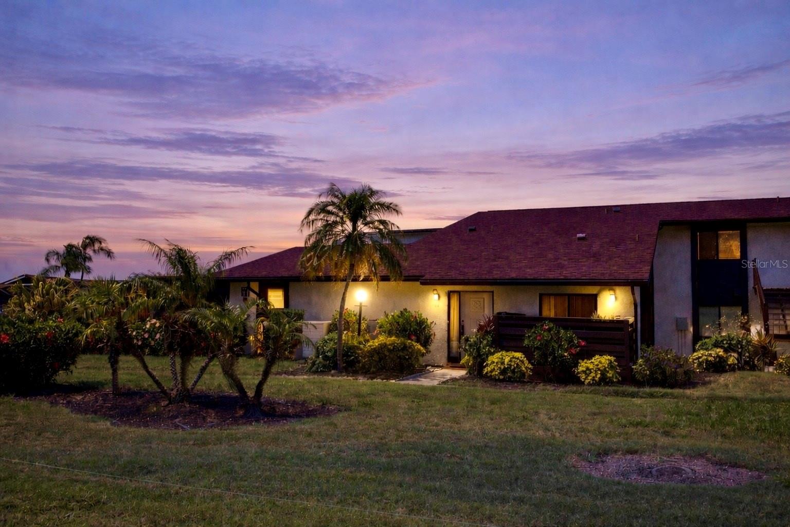 Welcome Home to carefree Florida Living in Bradenton’s well-established, Morton Village! Experience the easy, maintenance-free lifestyle you’ve been dreaming of in this desirable 55+ community. Here, you truly have a home without the home work—with exterior maintenance, water, sewer, trash, pest control, basic cable, and internet all included in your monthly fee. This highly sought-after ground-floor end unit lives like a private villa, offering no upstairs neighbors and the seldom available, added convenience of your very own covered, assigned parking space. Inside, you’ll find a thoughtfully designed, clean, spacious, split-bedroom floor plan for added privacy, complemented by vaulted ceilings and a generous primary bedroom with a full wall of closet space. The updated kitchen has newer cabinetry, lighting, appliances, porcelain tiled countertop, and eat-in high bar area with stone counter. Newer laminate flooring in the living/dining, hallway and master bedroom. Step outside to your expansive lanai, which is AC vented and accessible from both the living room and primary suite—it's the perfect space to relax and unwind. The lanai features a spacious storage room with washer & dryer, along with a secondary side entrance leading to the parking, mail kiosk and short walk to community amenities. Additional highlights include; primary bedroom with ensuite bath, updated vanity and mirror, and a pull-down attic access from the second bedroom, with a large, walkable storage area. Active community amenities include; pool, shuffleboard, clubhouse, and a vibrant social calendar. Ideally located on the west side of Bradenton, just minutes from shopping, dining, and local favorites like Detwiler’s Farm Market—and just a short drive to the areas most stunning turquoise water and beautiful gulf beaches. A new shingle roof was installed in 2022, and BRAND NEW Rheem HOT WATER HEATER was just replaced in April 2026 and comes with a 6 year warranty from the manufacturer. Come see for yourself, an incredible opportunity to enjoy comfort, convenience, and value all in one. Schedule your private showing today.