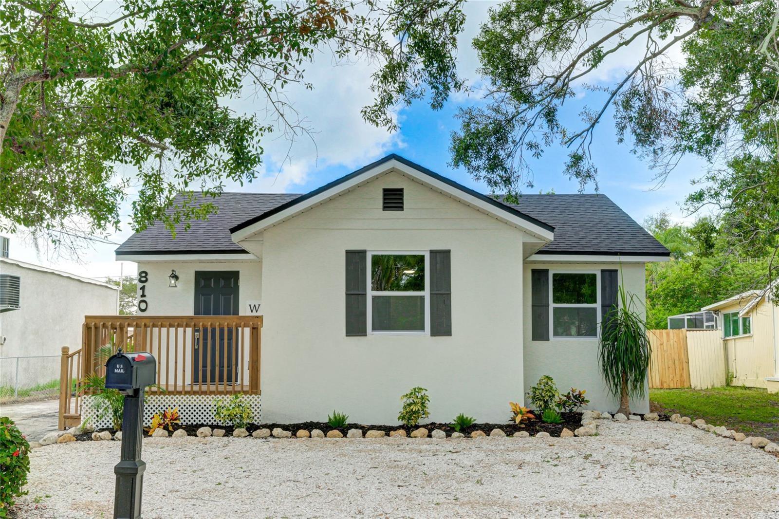 You have found your next home. Fully rebuilt from the slab up, this beautifully renovated home is ideally located just minutes from Downtown Bradenton. Enjoy quick access to the Riverwalk, dining, shopping, arts, and year-round events, all while living in a quiet residential setting.

The open floor plan offers a bright, welcoming feel with new laminate and tile flooring throughout. The kitchen features wood accents, a farmhouse sink, and modern fixtures, and flows into a separate dining area perfect for entertaining. Major updates include a new roof, new electrical and plumbing, new HVAC system with warranty, hurricane impact windows, hurricane ties, cement pads, new insulation, ceiling fans, and a large water heater—providing peace of mind for years to come.

The primary suite includes an ensuite bath and dual closets, while both bathrooms showcase a modern, HGTV-inspired design. A spacious backyard offers room for outdoor entertaining or recreation. No HOA.

Conveniently located three blocks from LECOM Park, approximately one mile from Manatee Memorial Hospital, minutes to area beaches, and a short drive to Tampa and Sarasota. An excellent opportunity to own a move-in-ready home near the heart of Brade