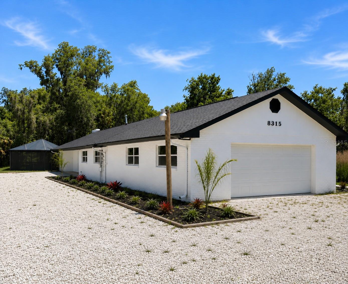 Tucked away on nearly 1.5 acres along the scenic Alafia River, , this renovated pool home offers the rare combination of space, privacy, and freedom that's becoming almost impossible to find in Riverview. Surrounded by mature trees and lush greenery, this fully renovated home features 3-bedroom, 3-bath plus bonus room and more than 2,400 square feet of living space. The thoughtful floor plan includes a spacious primary suite as well as an additional en-suite bedroom, providing the perfect setup for guests, multi-generational living, or added privacy for family members. The versatile floor plan offers multiple living and gathering spaces, while large windows fill the home with natural light and showcase peaceful views of the surrounding property. Major system updates provide peace of mind, including a new roof, impact windows, new well pump, updated HVAC components, new flooring throughout, and a beautifully renovated kitchen. The heart of the home is the oversized island, providing the perfect space for gathering, entertaining, and everyday living. The oversized homesite creates endless possibilities for entertaining, gardening, hobbies, a workshop, or simply enjoying the tranquility of your own private slice of Florida. Properties offering this amount of land and freedom are becoming increasingly difficult to find in Riverview. Conveniently located near shopping, dining, schools, and major commuter routes, this property provides the perfect balance of privacy and accessibility. Whether you're looking for room to spread out, space for all your toys, or a peaceful retreat away from cookie-cutter communities, 8315 Revels Road delivers the land, upgrades, and lifestyle you've been searching for. Select photographs have been professionally edited, virtually staged and enhanced.