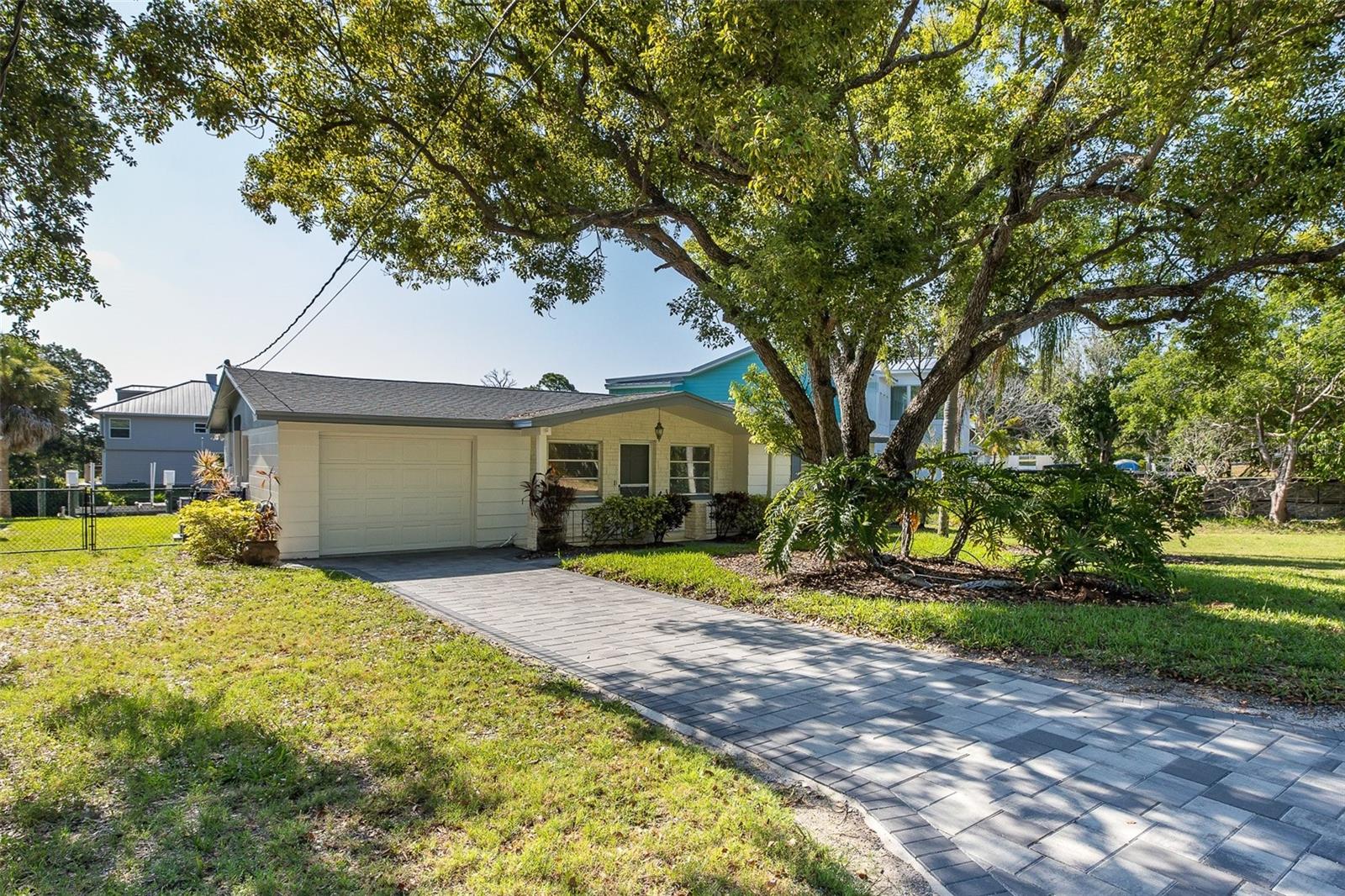 NEVER FLOODED DURING HURRICANE HELENE! This is a rare opportunity to own a Gulf-access waterfront home that offers both an exceptional boating lifestyle and added peace of mind. According to the seller, the home has never experienced flooding or water intrusion, making it an outstanding choice for buyers seeking waterfront living with confidence. Nestled in the highly desirable Baileys Bluff Estates, this move-in-ready waterfront home sits on an oversized 0.31-acre lot with approximately 55 feet of saltwater canal frontage, offering direct Gulf access in about one minute. Bring your boat, kayaks, paddleboards, and fishing gear—your waterfront adventures begin right in your own backyard. Boaters will appreciate the private boat ramp, 10,000-pound boat lift, with, stationary dock, and concrete seawall, making launching and storing your boat effortless. Spend your days fishing, scalloping, island hopping to Anclote Key, or watching spectacular Gulf sunsets just minutes from home. Inside, you'll find an inviting floor plan featuring 2 bedrooms, 1.5 baths, an updated kitchen with solid wood cabinetry, updated bathrooms, comfortable living spaces, and a bright Florida room overlooking the tranquil canal. The home has been well maintained and is ready for its next owner. Major recent improvements provide outstanding value, including a brand-new roof (2025) and a brand-new air conditioning system, helping reduce future maintenance costs while increasing buyer confidence. The spacious backyard provides plenty of room to entertain, garden, or simply relax while enjoying peaceful waterfront views and abundant Florida wildlife. Located just minutes from Anclote River, the Gulf of Mexico, Key Vista Nature Park, the famous Tarpon Springs Sponge Docks, beaches, waterfront dining, shopping, and medical facilities, this home offers the perfect balance of recreation and convenience. Whether you're looking for a year-round residence, seasonal retreat, or waterfront investment, opportunities like this are becoming increasingly difficult to find. No HOA, Move-in ready. Schedule your private showing today and discover why this exceptional Gulf-access waterfront property is one of Holiday's best boating values.