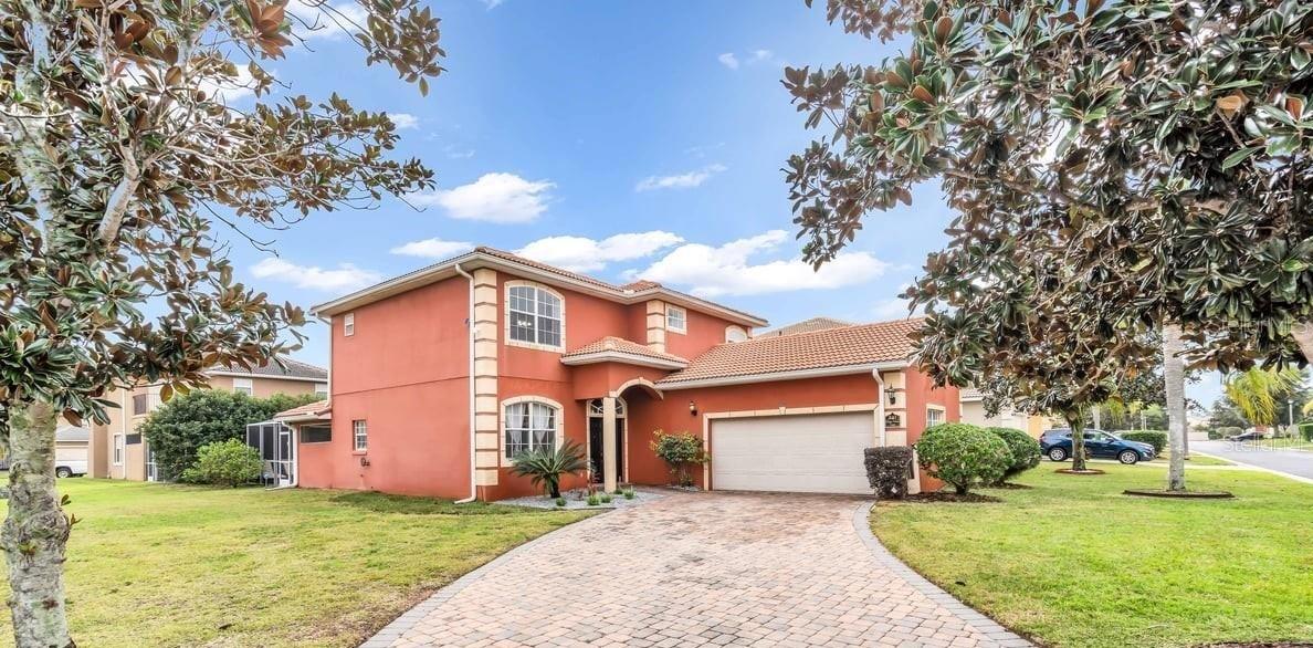 This magnificent 5-bedroom, 4-bathroom residence is located in the coveted Vista Park neighborhood of Davenport, Florida. Designed for comfort and style, this spacious home offers a luxurious private pool, tiled roof, 6-car driveway, and sleek, modern finishes that perfectly suit today's lifestyle. Its open, two-story design allows for abundant natural light, creating a bright and inviting atmosphere. The gourmet kitchen features granite countertops, stainless steel appliances, and a unique rotating island, ideal for gatherings and entertaining. The two primary suites had a true retreat feel, with spa-like bathrooms and spacious walk-in closets. The additional bedrooms are spacious and include ample storage. Enjoy tranquil views from the covered terrace while sipping your morning coffee, hosting a barbecue, or watching the sunset. Ideally located just minutes from Disney World, Champions Gate, Margaritaville, Universal Studios, Premium Outlets, and countless shops and restaurants. Perfect for year-round family living. Offered fully furnished unless otherwise requested. Don't miss this unique opportunity in a prime location!