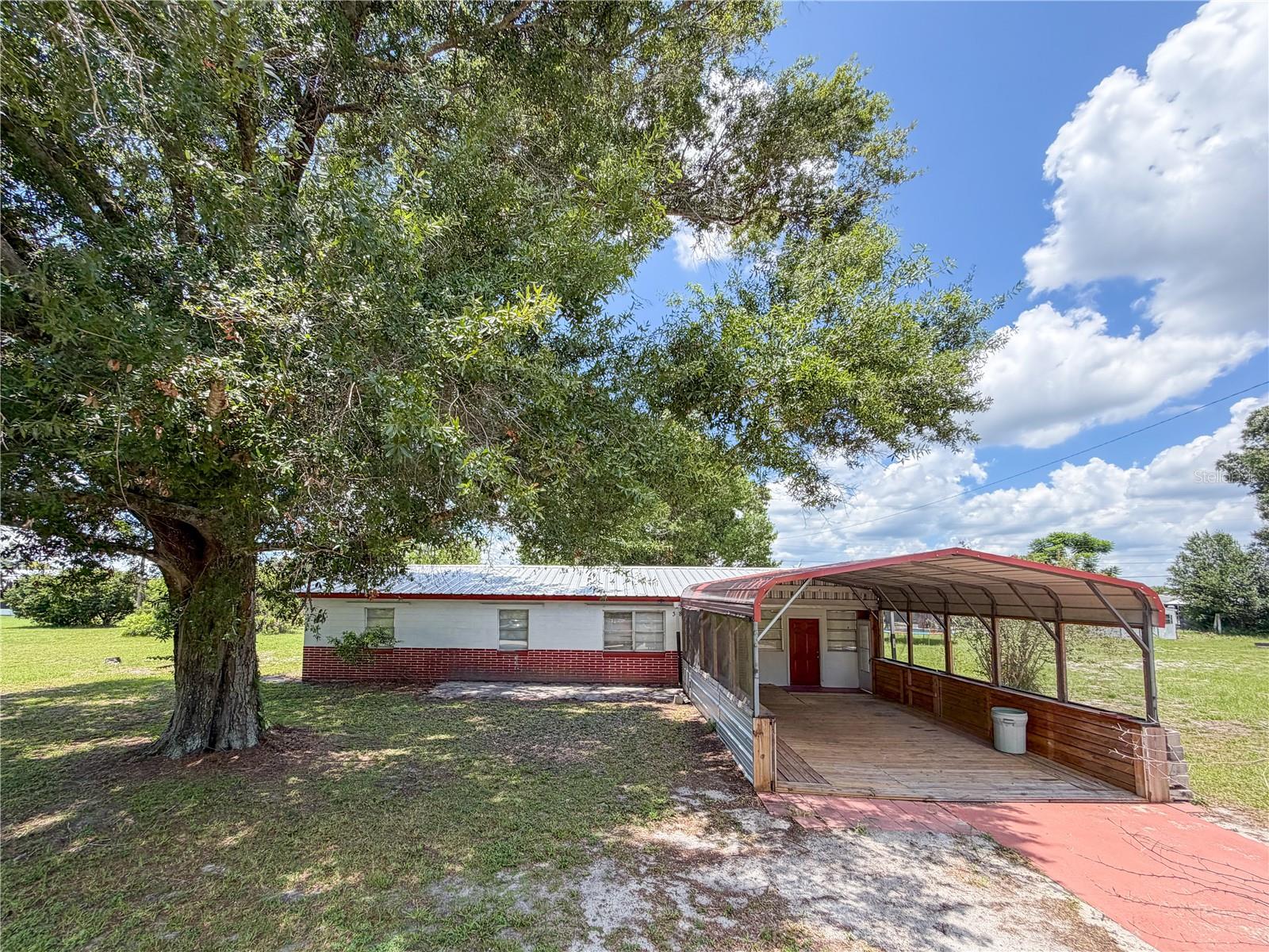 Nestled on a massive lot in the heart of Frostproof, this property offers the perfect combination of space, comfort, and location. Inside, you'll love the beautiful cabinetry, spacious living areas, and a wonderful floor plan designed for both everyday living and entertaining. Recent improvements include a newer metal roof, newer AC, 200-amp electrical service, and a beautifully remodeled bathroom. A newer oversized storage shed provides exceptional space for tools, hobbies, equipment, or all of your outdoor toys. The neighborhood offers the flexibility of an HOA if desired, while allowing homeowners the choice to participate. 

One of the biggest highlights is the incredible location. Frostproof is known for its beautiful lakes, world-class bass fishing, boating, kayaking, and endless outdoor recreation, making it a paradise for outdoor enthusiasts. Whether you're spending the day on the water, exploring nearby parks, or simply enjoying the peaceful surroundings, you'll love the Florida lifestyle this community offers. Best of all, you're just minutes from shopping, restaurants, schools, and everyday conveniences. With a massive lot, beautiful finishes, abundant storage, and an excellent floor plan, this home truly has something for everyone.