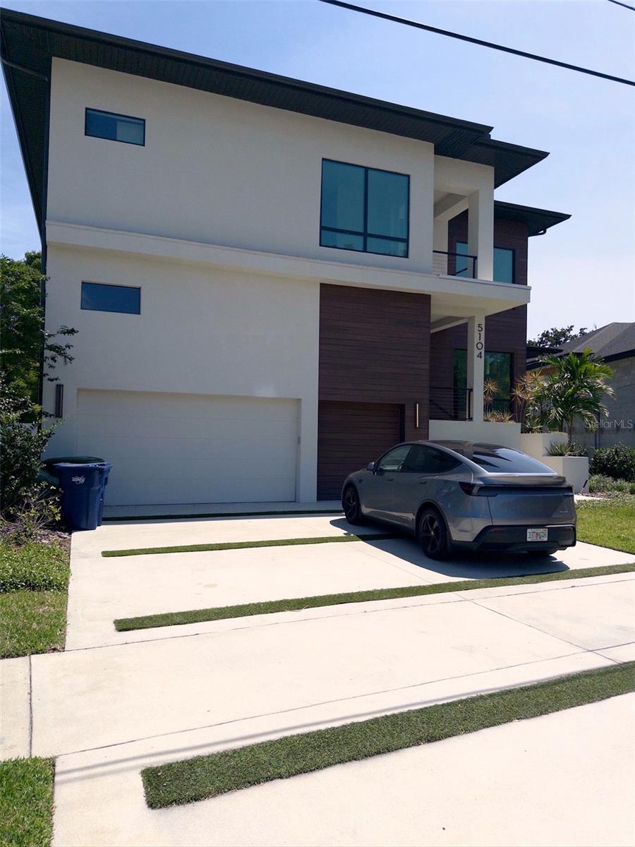 Experience modern luxury in the heart of the sought after Beach Park with this newly constructed custom residence offering over 4,800 square feet of thoughtfully designed living space. Built in 2023, this exceptional 5-bedroom, 6.5-bath home blends luxury contemporary design with effortless indoor-outdoor living in one of South Tampa’s most desirable neighborhoods.

From the moment you enter, soaring ceilings, wide-plank wood flooring, and walls of natural light create an impressive yet welcoming atmosphere. Designed for both everyday living and upscale entertaining, the open-concept floor plan features expansive living and dining spaces centered around a stunning chef’s kitchen complete with premium Wolf and Sub-Zero appliances, custom cabinetry, oversized island, quartz countertops, and a fully equipped butler’s pantry.

A striking glass wine room serves as a true focal point, while oversized sliding glass doors seamlessly connect the interior living areas to the resort-style outdoor space. Enjoy a heated pool, travertine lanai, summer kitchen, and multiple covered entertaining areas designed for year-round Florida living.

The luxurious primary suite offers a private retreat with spa-inspired bath, oversized custom closets, and serene views overlooking the outdoor living space. Each additional bedroom features its own en-suite bath, providing both comfort and privacy for family and guests alike.

Additional highlights include hurricane-impact windows, 3-car garage, elevator shaft for future elevator installation, designer lighting and finishes throughout, and exceptional attention to detail at every turn.

Ideally located in Beach Park, residents enjoy convenient access to Tampa International Airport, International Plaza, Hyde Park Village, Downtown Tampa, Water Street, top-rated dining, and shopping in South Tampa.

A rare opportunity to own a truly turnkey custom luxury home without the wait of new construction.
