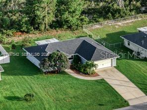 Fractional Ownership. Welcome home to this beautiful 3 bedroom, 2 bath home located in the heart of Lake Placid, your own slice of Florida paradise. This inviting home features an open layout perfect for everyday living or entertaining guests. The kitchen offers granite countertops, a spacious island, and stainless steel appliances. The primary suite includes a large walk in closet and dual sinks. Additional features include a 2 car garage and an extended paved driveway providing plenty of parking. Step outside and enjoy a covered terrace surrounded by avocado, mango, orange, and persimmon trees, creating a private backyard oasis. Conveniently located close to Lake Placid’s shops, restaurants, lakes, and more.
