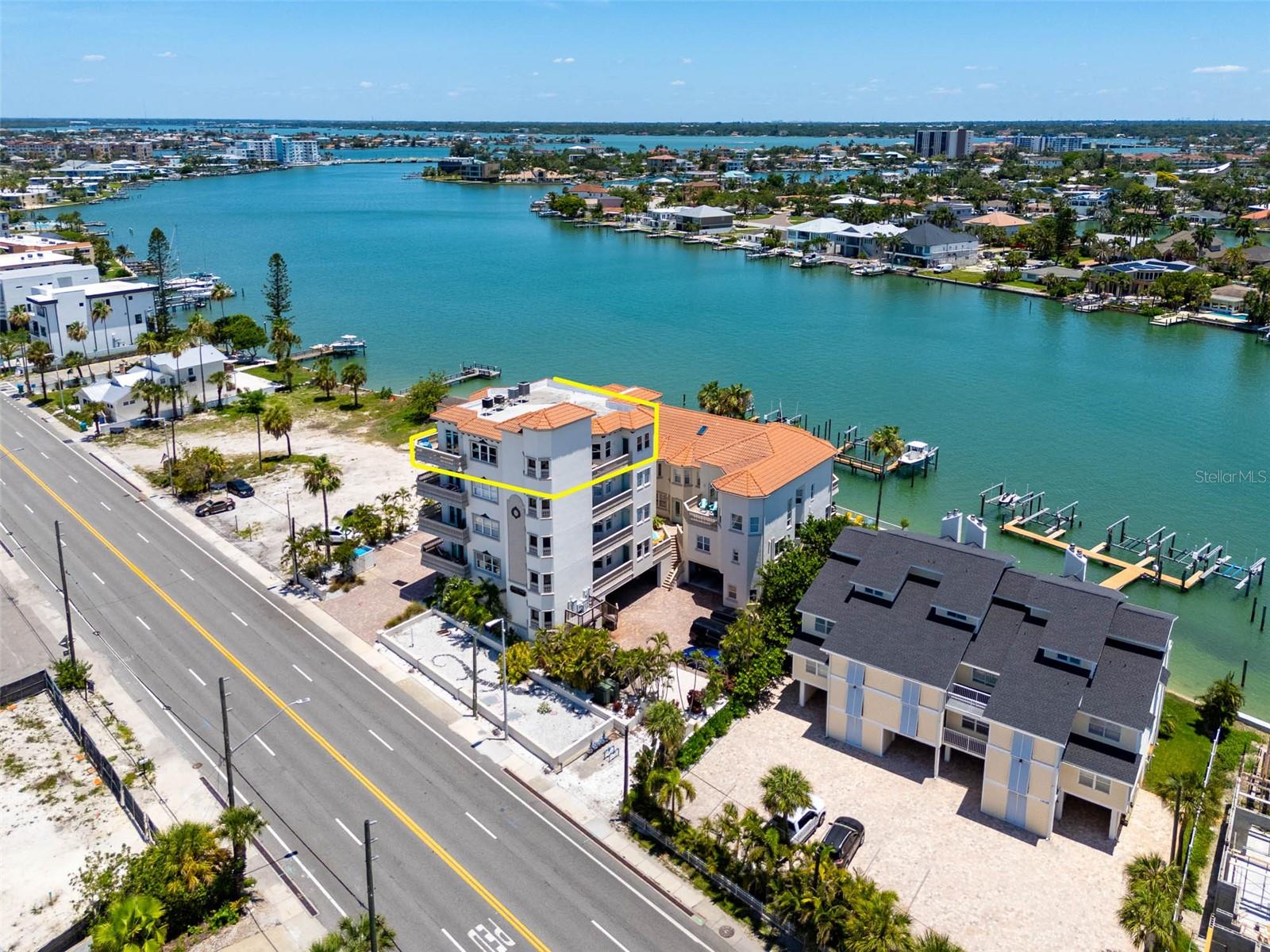 Experience coastal luxury at its finest in this spectacular Penthouse residence on Treasure Island. Enjoy year-round breathtaking sunsets and panoramic views of the Gulf of Mexico, intracoastal waterway and Downtown St Pete from its expansive private balcony and roof top! Offering private elevator access directly into your unit with 3 bedrooms, 3 bathrooms, and a deeded 10k lb boat lift, this exceptional waterfront retreat has everything you need. 
Designed to maximize natural light and showcase the stunning surroundings, the open-concept floor plan features high ceilings, elegant crown molding, and spacious living and dining areas ideal for both entertaining and everyday living. The beautifully updated kitchen is a chef's delight, featuring quartz countertops, white cabinetry, KitchenAid stainless steel appliances, and a sunny breakfast nook perfect for morning coffee with a view.
The primary suite serves as a private sanctuary with balcony access, a large walk-in closet, dual vanities, a relaxing soaking tub, and a separate walk-in shower. Two additional bedrooms and bathrooms provide ample space for family and guests. Additional highlights include 4 balconies, updated hurricane-impact windows (2024), custom window treatments, abundant storage, and a coveted waterfront lifestyle. The unit also has 2 deeded covered parking spaces.  
Enjoy the best of Treasure Island living with beach access just across the street, allowing you to spend your days on the sugar-sand shores of the Gulf and your evenings watching spectacular sunsets from home. Residents enjoy a prime location near the shops, restaurants, and entertainment of Treasure Island, John's Pass Village & Boardwalk, waterfront dining, boating, fishing, golf courses, and miles of scenic waterfront trails. Convenient access to downtown St. Petersburg, St. Pete and Tampa airports, and world-class cultural attractions makes this an exceptional opportunity to own a piece of Florida paradise.