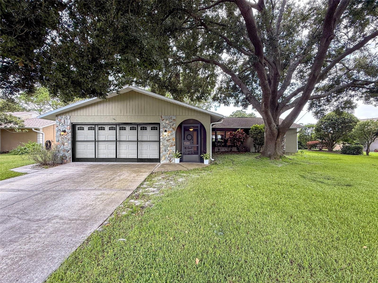 Welcome to your beautifully remodeled home in sunny Tampa Bay! 2026 NEW ROOF and NEWER HOT WATER HEATER (approximately 2 yrs)! Tucked away in a quiet, park-like community, this light-filled residence offers a peaceful setting, excellent privacy, and a warm, inviting atmosphere from the moment you step inside. The spacious interior features vaulted ceilings, luxury vinyl plank flooring, quartz countertops, shaker-style cabinetry, an eat-in kitchen and dining area, breakfast bar, walk-in pantry, dedicated laundry space, and a desirable split-bedroom floor plan with generously sized bedrooms. A built-in fireplace surrounded by storage cabinetry creates a comfortable focal point for the main living area, while two screened porches provide additional space to relax and enjoy the outdoors. Step outside to your private backyard oasis overlooking a peaceful pond, perfect for bass fishing, gardening, or simply unwinding while enjoying the shaded property and tranquil water views. Residents can also take advantage of the community pool. Conveniently located near highly rated schools, shopping, golf courses, restaurants, and everyday conveniences, this move-in-ready home offers the ideal combination of comfort, privacy, and the Florida lifestyle.