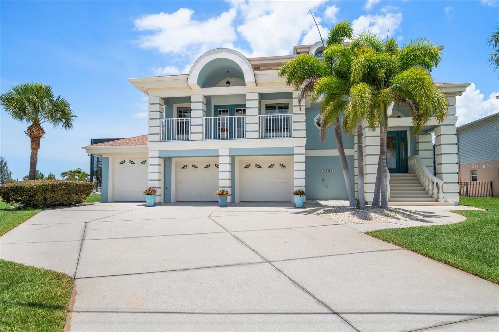 $90,000 PRICE IMPROVEMENT! Priced to SELL!! AMAZING PRICE! AMAZING LOCATION! Rarely does a waterfront property offer this combination of panoramic Gulf views, direct boating access, exceptional privacy, and over 5,000 square feet of usable space at this value.
Situated on a premier point lot in Hernando Beach, this custom-built waterfront home captures breathtaking, unobstructed views of the Hernando Beach Flats and Gulf of Mexico from nearly every room. Featured in Haven Magazine, the residence offers 3 bedrooms, 2.5 baths, an oversized 3-car garage, four waterfront verandas, and approximately 1,700 square feet of newly renovated bonus space on the lower level.
Designed for both entertaining and everyday living, the open-concept floor plan features soaring ceilings, engineered hardwood flooring, and a chef's kitchen complete with custom cabinetry, stainless steel appliances, dual convection ovens, an oversized island, and a spacious butler's pantry. The primary suite occupies its own private retreat with direct veranda access, stunning water views, a spa-inspired bath, soaking tub, walk-in shower, and dual vanities. Upstairs, two guest bedrooms, a full bath, and an additional living area provide plenty of space for family and visitors. The newly renovated lower level offers endless flexibility for a home office, fitness room, media room, guest space, game room, or future multigenerational living. An elevator shaft is already in place for future installation. Step outside to your private backyard oasis featuring a solar-heated saltwater pool with waterfall, expansive screened enclosure, tropical landscaping, and multiple areas for outdoor entertaining. Boaters will appreciate the private dock, 10,000-pound boat lift, and kayak launch with quick access to the Gulf of Mexico, world-class fishing, scalloping grounds, waterfront restaurants, and the natural beauty of Florida's Nature Coast. If you've been searching for a waterfront home that delivers spectacular views, boating convenience, resort-style outdoor living, and exceptional value, this is an opportunity you don't want to miss. Schedule your private showing today and experience why this property stands apart from anything else currently available in Hernando Beach.