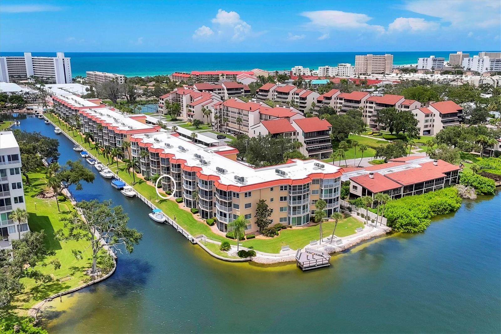 SIESTA HARBOR...55+...BEAUTIFUL CANAL & Intercoastal Water Way VISTAS with boats slowly IDILYING By and YOU HAVE BEACH ACCESS. BRING YOUR BOAT up to 30' because it only costs $1,000 ANNUALLY to berth your boat at your home! BUT WAIT till you see this TOTALLY RENOVATED BEAUTIFUL 1 bedroom 2 full bathroom condo! NEW, NEW, NEW...everything is new...Ceramic tile flooring, baseboards, interior doors & hardware, impact windows throughout, Popcorn removed and new texture ceilings, New electric plugs and switches, new kitchen with floating cabinetry, Quartz counters, new appliances, High end and modern lighting fixtures throughout, updated bathrooms also with floating vanities, incandescent lighting mirrors, new shower, New hot water tank, HVAC is only 2 years old, etc. You have plenty of storage as the bedroom has 2 closets (one is walk in), linen closet, Hall coat closet, pantry closet AND just outside your front door is a storage room for your bikes etc.! Amenities include a beautiful pool overlooking the water, shuffleboard, rec center, pier for boat watching and gatherings, tandem boat docks, fitness center FREE laundry on 2nd, 3rd and 4th floors PLUS FOB access to the beach across the street @ Crescent Arms. ALSO you have one DESIGNATED covered carport parking spot #537 with plenty of guest parking. Outdoor grilling SPOT. Rental friendly but no pets except authentic guide dogs. PRICED BELOW MARKET AT $373,900 Please consider a pre-approval from Buddy Moore / Owner of Moore Mortgage here in Sarasota...Buddy will pay for your appraisal (a $650 value) AND get you a GREAT RATE!
