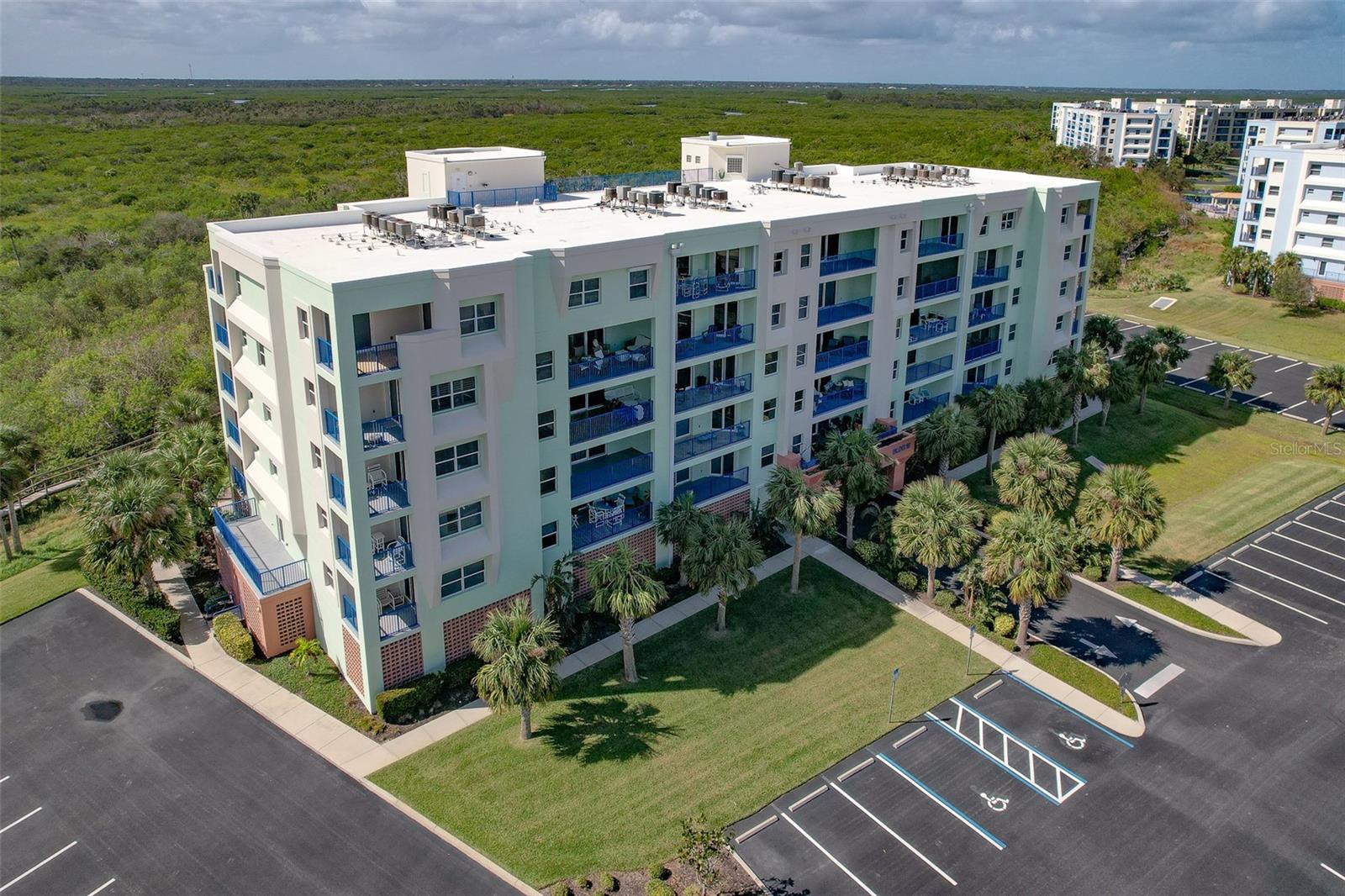 YOUR SLICE OF PARADISE AWAITS!  Wake up to breathtaking ocean views and enjoy the best of beachside living in this beautifully maintained, fully furnished 3-bedroom, 2-bath residence in New Smyrna Beach. Located on the third floor just across the street from the beach, this inviting coastal retreat offers the perfect combination of comfort, style, and convenience.  Lovingly enjoyed as a part-time residence since 2017, the condo has been thoughtfully updated and meticulously cared for. The spacious open layout flows seamlessly to a large tiled balcony where you can relax with your morning coffee or unwind to the soothing ocean breeze and stunning views.  The well-appointed kitchen features granite countertops, updated fixtures, and a new garbage disposal, while both bathrooms also showcase granite finishes. The spacious primary suite offers a large walk-in closet and a spa-inspired bathroom complete with dual sinks, a jetted soaking tub, walk-in shower, updated faucets and showerhead, and a new comfort-height toilet. New luxury vinyl plank flooring in the primary bedroom adds warmth and modern style.  Additional highlights include a new air conditioning system (2021), new hot water heater (2026), new balcony fan (2024), private outdoor storage for beach gear, and a convenient wash tub for sandy toys and swimsuits after a day at the shore.  The community has also undergone significant recent improvements, including weatherproofing and exterior painting in 2023, along with waterproofing and painting of the walkways in 2025 — offering added peace of mind for years to come.  Whether you’re searching for a full-time residence, vacation getaway, or investment opportunity, this exceptional beachside property captures the relaxed coastal lifestyle that makes New Smyrna Beach so special.  Residents enjoy resort-style amenities including two clubhouses, two pools, spas, fitness centers, tennis courts, shuffleboard, bocce ball, and a scenic walking trail behind the complex. This rare gem has been exceptionally well cared for and is ready for its next owner. Schedule your private showing today!  Information deemed reliable but not guaranteed. Buyers should verify all information important to them.