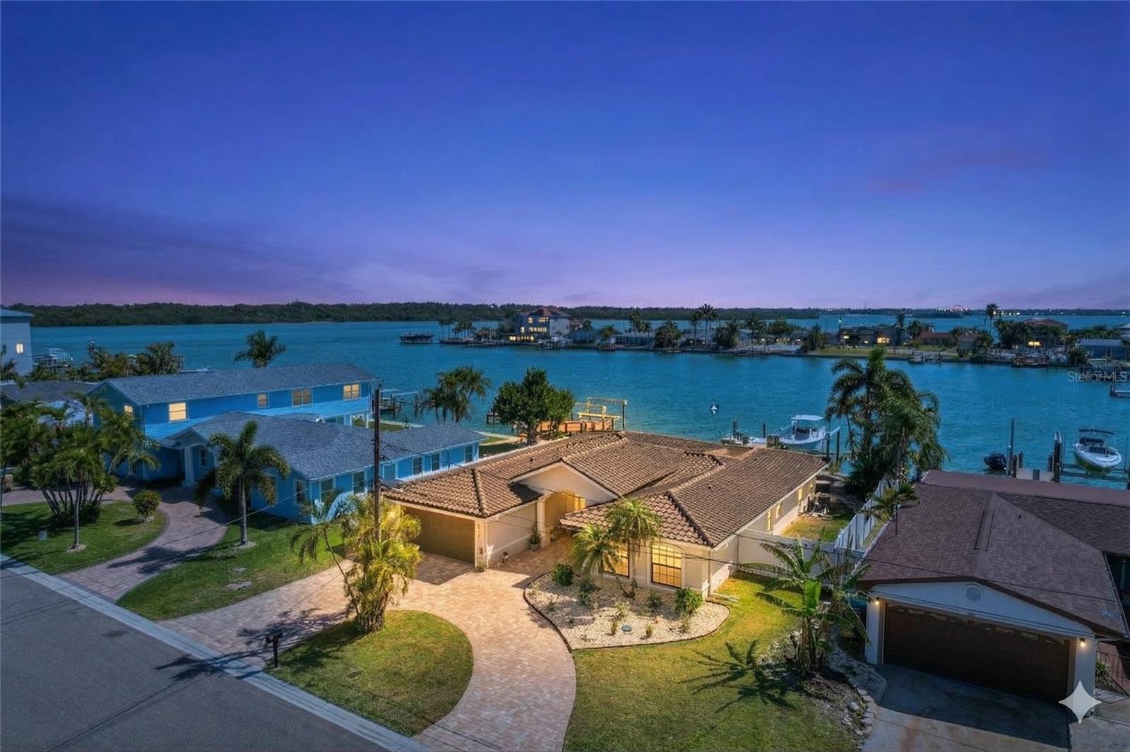 Waterfront Perfection on Boca Ciega Bay/ Intracoastal!
Experience the pinnacle of coastal living in this newly renovated Madeira Beach retreat, perfectly situated in the coveted Crystal Island enclave. This boater’s paradise features an expansive open floor plan that centers on panoramic Intracoastal views, with natural light pouring through brand-new hurricane-impact windows and sliding glass doors. Brand new updated kitchen featuring Frigidaire gallery appliance package, high-end quartz countertops, and top quality solid wood cabinetry with tons of space and storage throughout.  Every inch of the interior feels fresh and sophisticated, from the 2.5 updated bathrooms with LED mirrors and sleek fixtures to the updated plumbing, electrical, and designer lighting throughout. Outside, a private backyard oasis awaits, featuring a sparkling pool with an brand new Jandy pool equipment (2026) with full spa automation and salt water system plus brand new gas heater (buried LP tank) and brand new electric sub panel with wireless/phone app control, lush landscaping, and a 2022 private dock with a high-end boat 10,000 lb lift with gem remote recently serviced and inspected and ready for your boat offering direct Gulf access!  HVAC system is only a couple of years old and top quality Daikin, recently serviced/inspected, and in excellent shape. The Hot Water heater is brand new (2026), a 50-gal Rheem. Fenced back yard with all fencing and gates in great condition.  This terrific home comes complete with a spacious two-car garage and is located less than a mile from the beach. This turn-key residence offers a seamless blend of luxury, comfort, and the ultimate Florida waterfront lifestyle. Seller Financing available!!!