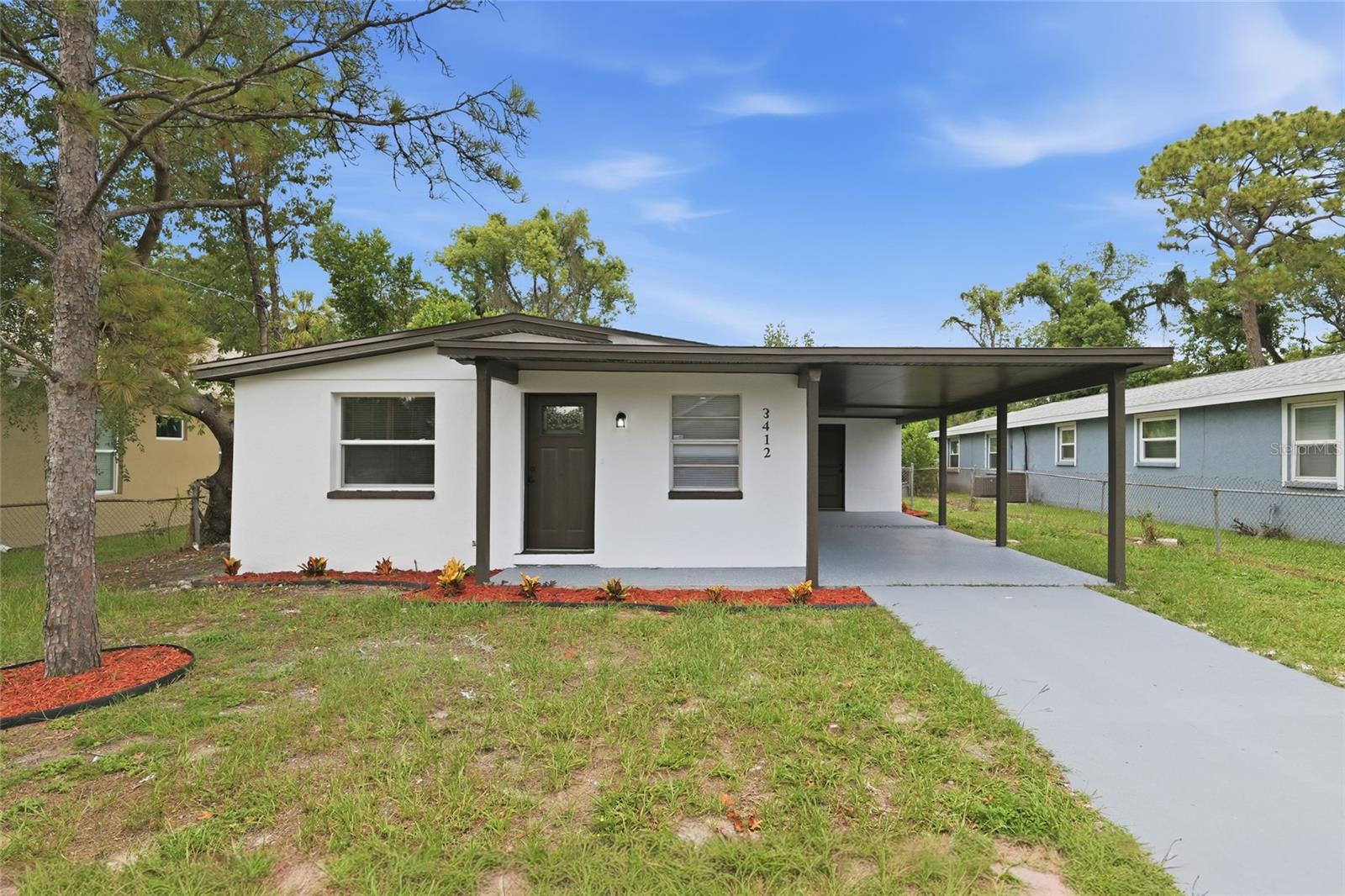 Virtually Staged. Welcome to 3412 E Henry Ave, a CHARMING 3-bedroom, 1-bath home offering comfort, convenience, and an unbeatable CENTRAL TAMPA LOCATION. Whether you're a first-time homebuyer, downsizing, or looking to expand your investment portfolio, this property presents an excellent opportunity to own in an established Tampa neighborhood.

Inside, you'll find an inviting layout featuring durable luxury vinyl and laminate flooring, an open living and dining area, and a functional kitchen complete with solid wood cabinetry, solid surface countertops, and plenty of storage. Natural light fills the home, creating a bright and welcoming atmosphere throughout.

Outside, enjoy a spacious backyard with room to relax, entertain, or make it your own, along with a covered carport for added everyday convenience.

One of this home's greatest highlights is its PRIME LOCATION. Conveniently situated near Downtown Tampa, historic Ybor City, the Tampa Riverwalk, Armature Works, USF, shopping, dining, entertainment, and local parks, you'll have easy access to everything the city has to offer. With nearby access to I-4, I-275, and other major roadways, commuting throughout the Tampa Bay area is effortless.

MOVE-IN READY and full of potential, 3412 E Henry Ave offers the perfect blend of comfort, convenience, and value in one of Tampa's most accessible locations. Don't miss your chance to make this home yours!