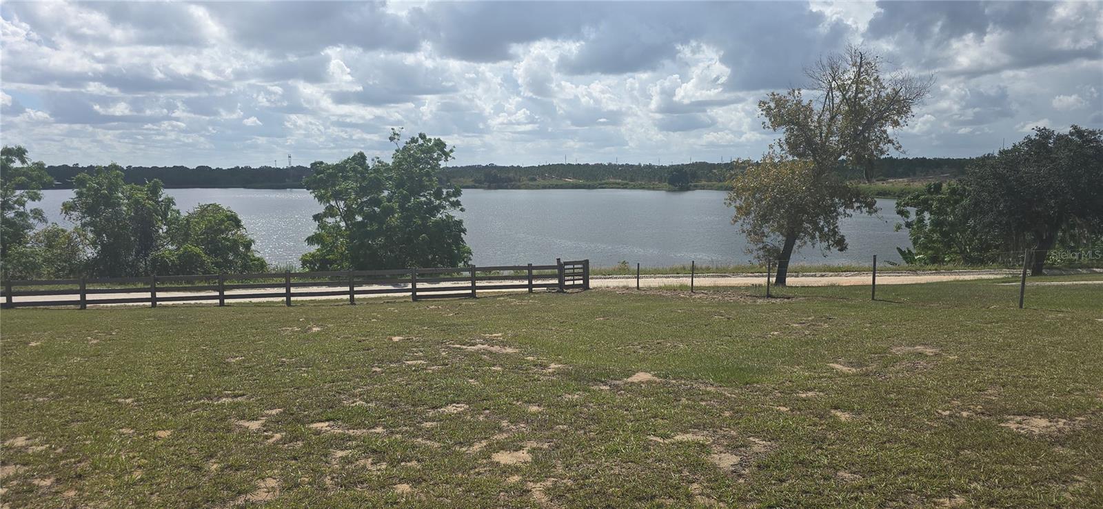 Back on the Market!!! Grab your animals and come on home. enjoy this 2 bedroom, 2 bath metal kit home on 5.26 acres. property located on semi-private Lake Ida. home features high ceilings with a spiral staircase. also includes a 140 sqft loft and large bedroom upstairs. Upstairs bedrooms has bathroom included. With over 5 acres, there is plenty of room to roam,garden or just to relax outside. I deal for those looking for a place to get away and spend a few months here, or those looking for small quant home with plenty of land for animals to roam