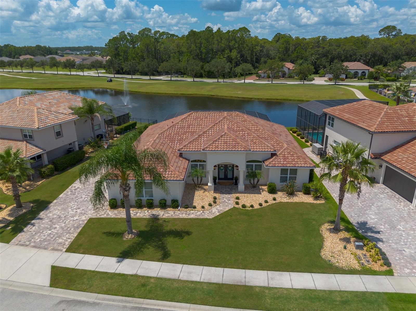 When you walk into this New Smyrna Beach Estate home your eyes are immediately drawn to the fantastic outdoor area with a heated pool, waterfront views, and pavers galore! The desirable layout, perfect for creating cherished memories, elevates this home's appeal in addition to the granite countertops, beautiful tile flooring and stainless-steel appliances. The home currently has a 3.6% ASSUMABLE mortgage for a large portion of the list price. This is extremely rare. The golf course view and outdoor kitchen area truly exude comfort and tranquility. Embrace this rare opportunity to own a sanctuary where the Florida sun, outdoor splendor, and well-maintained elegance harmonize. Don't miss your chance to experience the allure of this exceptional property, where better than new awaits you. All information is intended to be accurate but is not guaranteed. ;Water: City