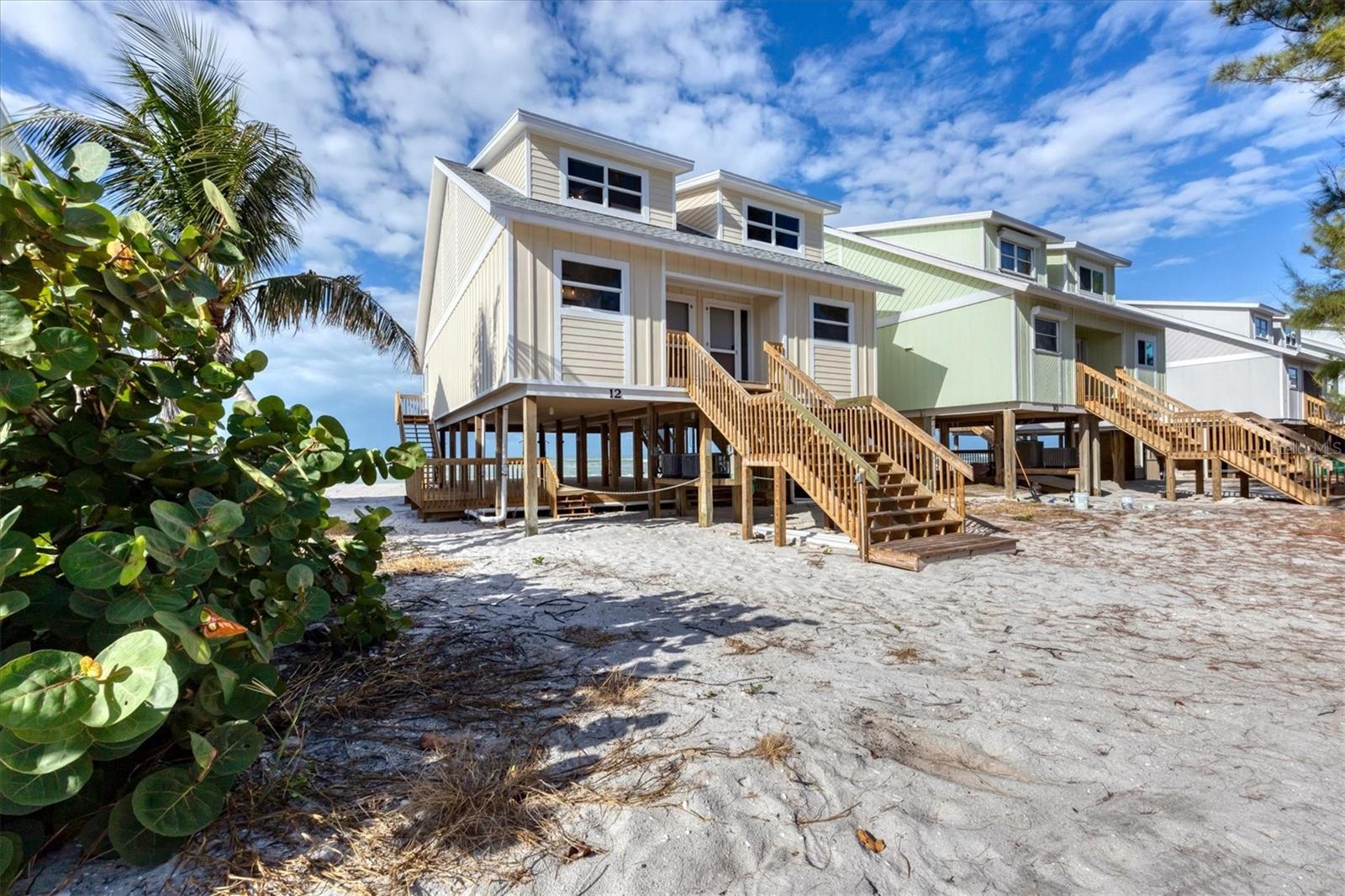 Beachfront Island Escape on Don Pedro Island – Fully Renovated with Incredible Investment Potential!

Welcome to your own slice of paradise in the charming Colony Don Pedro community. This beautifully renovated 2-bedroom, 2.5-bath beachfront residence offers the perfect blend of modern comfort, coastal charm, and the relaxed island lifestyle so many dream about. Whether you’re searching for a personal getaway, vacation rental opportunity, or long-term investment, this property delivers exceptional flexibility.

Adding to its appeal, Unit 11 next door is also available for purchase—creating a rare chance to own the entire building. Enjoy the option of a larger family retreat with additional space for guests or create two separate income-producing island rentals with outstanding rental potential.

Inside, you’ll find thoughtful updates throughout, including an updated kitchen and baths, upgraded flooring, electrical, plumbing, HVAC systems, and a newer roof. The open living spaces flow easily to private outdoor areas, including screened and open lanais designed for enjoying warm Gulf breezes, morning coffee, and spectacular evening sunsets. The covered area below provides the perfect shaded spot for gathering after a day spent on the water.

Just outside your door, miles of sandy shoreline invite you to enjoy shelling, shark tooth hunting, kayaking, paddleboarding, fishing, and peaceful walks along one of Southwest Florida’s hidden gems. Don Pedro Island offers a unique “Old Florida” coastal experience with uncrowded beaches, golf carts, boating, and abundant natural beauty—yet provides the modern conveniences needed for everyday comfort and quick, easy access to the mainland via the island’s short car ferry ride.

Colony Don Pedro residents enjoy wonderful amenities including a heated community pool, tennis court, and dockage with access to the Intracoastal Waterway and Gulf through just two bridges.

Beautifully updated, perfectly located, and offering a rare opportunity to expand—this beachfront retreat is ready to enjoy as your private island escape, investment property, or part of a larger coastal compound.

(Some photos are virtually staged.)