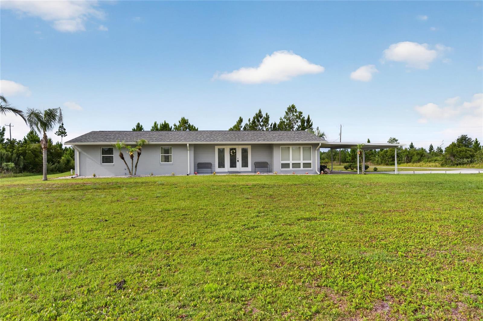 GRANDPARENTS, this is the house the grandkids want you to buy! This 13' x 26' pool home has everything you want and everything you need: Three nice-sized bedrooms and two bathrooms; a living room and family room with fireplace; a dining space just off the kitchen; a bonus room for office, den, or workout space; an inside laundry room with storage; a covered back porch for outdoor gatherings; a pool with spa; a tall RV carport and 11'11" X 20' shed, LP tank with Generac whole house generator -- all located on a quiet corner lot, about a mile from the clubhouse. There's plenty of space to play tag, soccer, badminton, hide & seek, croquet, or flag football on this 0.55 acre lot. Or set up a putting green or fire pit, or both! The RV carport is out back if you need it; or just turn it into an outdoor covered 30'6" X 24'6" picnic area. Or store your ATVs! The carport attached to the house is 25' x 20'6". There is plenty of room for all your toys on this property. But everyone will gather around the pool each day to splash around in the heat of the Florida sun, the reason we all live here! Indian Lake Estates (ILE) borders the largest lake in Polk County, so plan on fishing from the community pier or the shoreline. The Gary-Cobb-designed golf course is public and just down the road, and there are some special benefits offered to residents. The clubhouse restaurant is open 7 days a week. Take advantage of the putting green, tennis and pickleball courts, driving range, playground, game room and clubhouse activities when you feel like getting out of the house for a bit. There's always plenty to do. ILE is the perfect community blend of privacy and activity. Call your agent today and schedule to see this beautiful property.