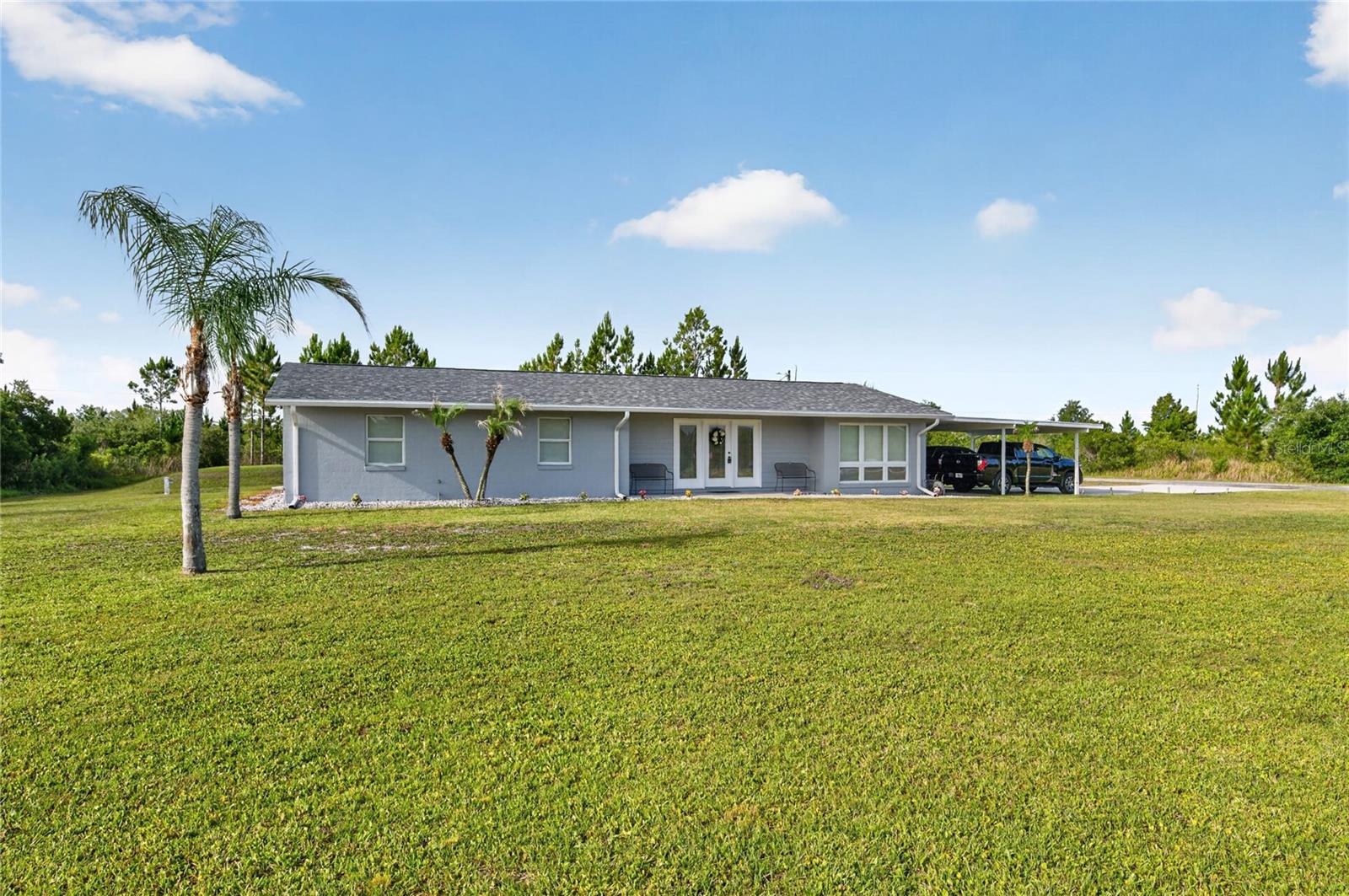 GRANDPARENTS, this is the house the grandkids want you to buy! This 13' x 26' pool home has everything you want and everything you need: Three nice-sized bedrooms and two bathrooms; a living room and family room with fireplace; a dining space just off the kitchen; a bonus room for office, den, or workout space; an inside laundry room with storage; a covered back porch for outdoor gatherings; a pool with spa; a tall RV carport and 11'11" X 20' shed, LP tank with Generac whole house generator -- all located on a quiet corner lot, about a mile from the clubhouse. There's plenty of space to play tag, soccer, badminton, hide & seek, croquet, or flag football on this 0.55 acre lot. Or set up a putting green or fire pit, or both! The RV carport is out back if you need it; or just turn it into an outdoor covered 30'6" X 24'6" picnic area. Or store your ATVs! The carport attached to the house is 25' x 20'6". There is plenty of room for all your toys on this property. But everyone will gather around the pool each day to splash around in the heat of the Florida sun, the reason we all live here! Indian Lake Estates (ILE) borders the largest lake in Polk County, so plan on fishing from the community pier or the shoreline. The Gary-Cobb-designed golf course is public and just down the road, and there are some special benefits offered to residents. The clubhouse restaurant is open 7 days a week. Take advantage of the putting green, tennis and pickleball courts, driving range, playground, game room and clubhouse activities when you feel like getting out of the house for a bit. There's always plenty to do. ILE is the perfect community blend of privacy and activity. Call your agent today and schedule to see this beautiful property.