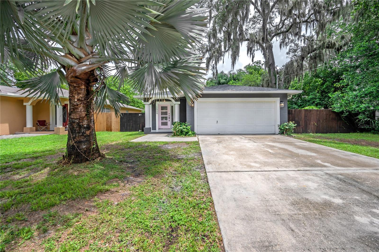 Live in the heart of Seminole Heights, just minutes from the neighborhood’s favorite spots like The Independent, Cappy’s Pizza, Corner Club, and Angry Chair Brewing. Publix is right down the street, and you’ll have quick access to I-275, Downtown Tampa, Amalie Arena, and the Tampa Riverwalk. This block construction home blends the charm of the Heights with the peace of mind of newer updates. A newer roof, newer HVAC, brand new septic system, and brand new privacy fence mean less maintenance and more comfort. The open-concept floor plan connects the kitchen, living, and dining areas, while a custom-built mudroom nook sits just inside from the 2-car garage. The kitchen is a standout, featuring painted sage green cabinetry, quartz countertops, herringbone glass subway tile backsplash, stainless steel appliances with a slide-in range, a custom-built hood, and open shelving. Durable vinyl flooring runs throughout the living spaces and bedrooms, and the primary suite offers a private ensuite bathroom. Step outside to a huge backyard with a detached shed and a screened-in lanai — perfect for relaxing or entertaining. This home offers style, space, and a prime location in one of Tampa’s most vibrant neighborhoods. Call today!