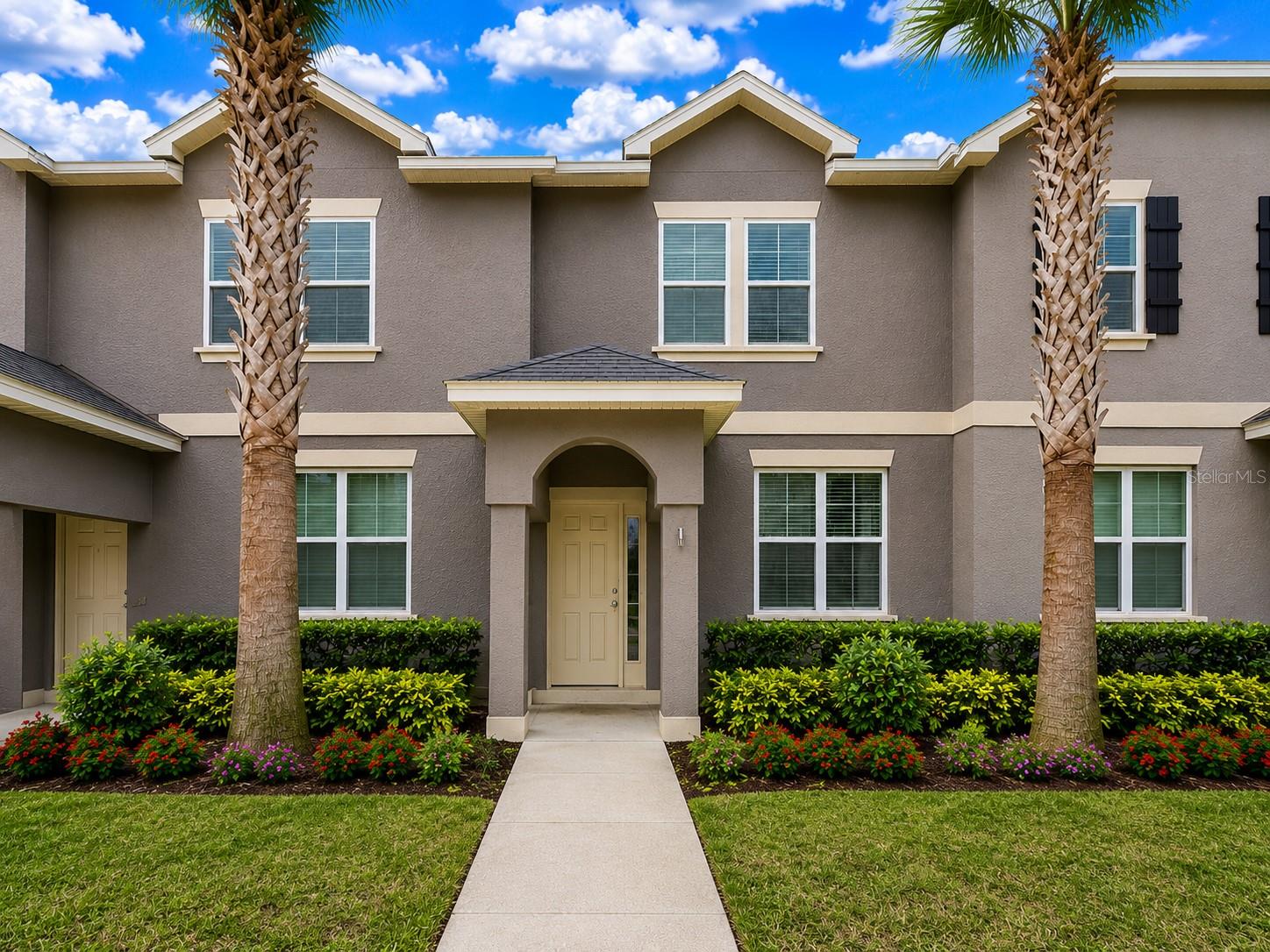 Experience comfortable living in this beautifully upgraded 3-bedroom, 2.5-bathroom townhome located in one of Windermere's most desirable communities. Thoughtfully designed with both style and functionality in mind, this home features a bright open-concept floor plan filled with natural light, spacious living areas, and tasteful upgrades throughout. The kitchen serves as the heart of the home, showcasing modern countertops, stainless steel appliances, and generous prep space that seamlessly flows into the dining and family rooms, making it ideal for everyday living and entertaining. Upstairs, the spacious primary suite offers a relaxing retreat with a large walk-in closet and an inviting en-suite bathroom featuring dual vanities, a soaking tub, and a separate shower. Two additional bedrooms provide ample space for family, guests, or a home office, while the conveniently located upstairs laundry room adds to the home's practicality. Step outside to enjoy the private brick-paver courtyard, perfect for outdoor dining, grilling, or simply unwinding in your own outdoor oasis. A detached two-car garage offers additional storage and convenience and has been enhanced with ventilation for improved comfort and functionality. An additional refrigerator is also included, providing valuable extra storage space for beverages, groceries, and entertaining essentials. Residents will appreciate being just minutes from Disney theme parks and University. The community features resort-style amenities, including a sparkling pool, walking and biking trails, beautifully landscaped common areas, and ample guest parking. The location is truly exceptional, offering close proximity to top-rated Windermere schools.