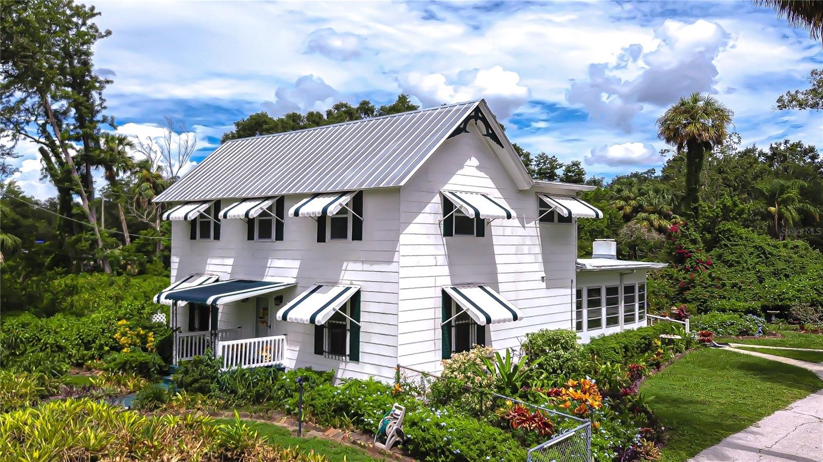 Get ready to fall in love with these 6 acres of history, charm & endless possibilities in the heart of Riverview. Spanning 6 acres of picturesque land, this unique property offers an extraordinary combination of history, charm, and versatility. With ASC-1 zoning (Agricultural, Single-Family, 1 Acre Minimum), the possibilities are endless—you can enjoy a private estate, create a multi-generational homestead, raise horses or small livestock, or run certain home-based businesses while maintaining the property’s residential character. The acreage, dual access points, and two on-site utility poles open the door for ventures like a charming tea room, a workshop, an Airbnb retreat, or simply preserving it as a rare and peaceful slice of Riverview’s past. Recent updates ensure both charm and peace of mind: metal roof replaced in 2011 with Galvalume metal and hurricane strapping, flat roof added in 2025 with a 25-year warranty, upgraded AC mini-splits upstairs (2017), new downstairs AC unit (2023) with a 12-year warranty, electrical panel box replaced in 2019, and a Rheem water heater installed in 2021.If the stunning grandfather oaks could talk, they’d share captivating stories from Riverview’s early days, when the area was a bustling hub for pine milling. Today, the same location is just minutes from vibrant restaurants, top-rated schools, and world-class medical facilities, offering the perfect blend of country living and city convenience. Built in 1910 by master carpenter James L. Hackney as his personal residence, the home was crafted to stand the test of time—no shortcuts taken. When it changed hands in 1952, its new owner, an employee of GE, infused it with the latest modern conveniences of the era. Inside, you’ll find five bedrooms, including the primary suite on the main floor, a spacious great room, and a large Florida sunroom just off the kitchen—perfect for gathering with family and friends. Step outside to explore the naturally manicured grounds, bursting with tropical flowers, and take a peaceful stroll around the backyard pond, where Mother Nature displays her most beautiful, untouched side. Opportunities like this are rare. Here’s your chance to own not just a home, but a remarkable piece of Riverview’s history. Conveniently located north of the Alafia River, this property is just 10 minutes from a boat ramp on the river and offers easy access to the Crosstown Expressway and I-75 entrance ramp. Situated just past Bloomingdale on US-301, you’ll enjoy both peaceful country living and quick connectivity to everything Riverview and the surrounding area have to offer.