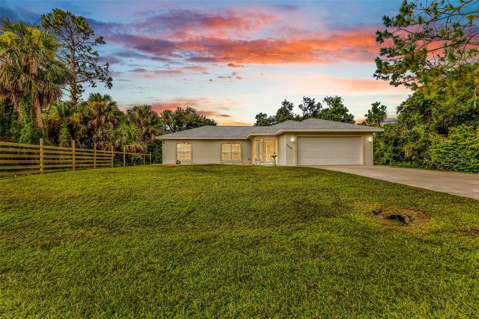 Welcome to 1191 Nebraska Ln, a three bedroom, two bathroom, two car garage home in the fast-growing and desired city of North Port in Sunny Southwest Florida! Here you will find a NEW ROOF in 2023 and a split-floorplan with just under 1300 square feet of living space with tile and laminate flooring throughout. Your main bedroom suite is on the right side of the home along with the laundry room and garage, your living room, dining room, and kitchen are located in the middle with access to the lanai through sliding glass doors, and the spare bedrooms and second bathroom are located on the left of the home, giving this home a convenient and often desired layout!
Make sure to check out the VIRTUAL TOUR and 3D FLOORPLAN to get a better look of this home before calling your favorite real estate agent to schedule a private tour of your own. Nebraska Ln is located in a nice area of North Port, “off Chamberlain Blvd”, which is conveniently located near US41 & I75, and very close to three different shopping centers including Price Crossing just about 2 miles away.
This home is perfect for first-time homebuyers, someone looking to buy a second home, vacation home, or even rental property! Cash, conventional, VA and FHA buyers are all welcome! Come see this cute and affordable home today!
