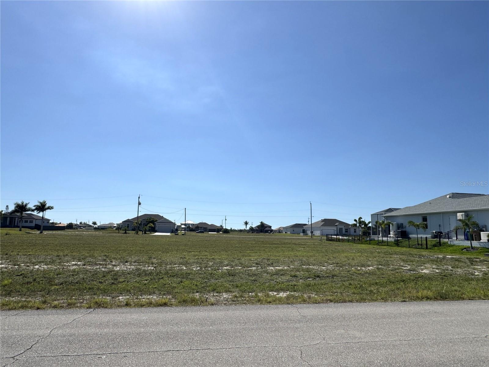 Build your new home on this cleared residential lot in NW Cape Coral, Florida. This neighborhood features many beautiful new homes, some on the Gulf access North Spreader. Located just minutes from the new Crystal Lake Park with walking path, beach, picnic shelters, multiple work-out stations, playground equipment, lookout hill with views of the beautiful Florida sunsets on Charlotte Harbor, boat launch and public restrooms. This is the lowest priced lot in this neighborhood and priced for quick sale.