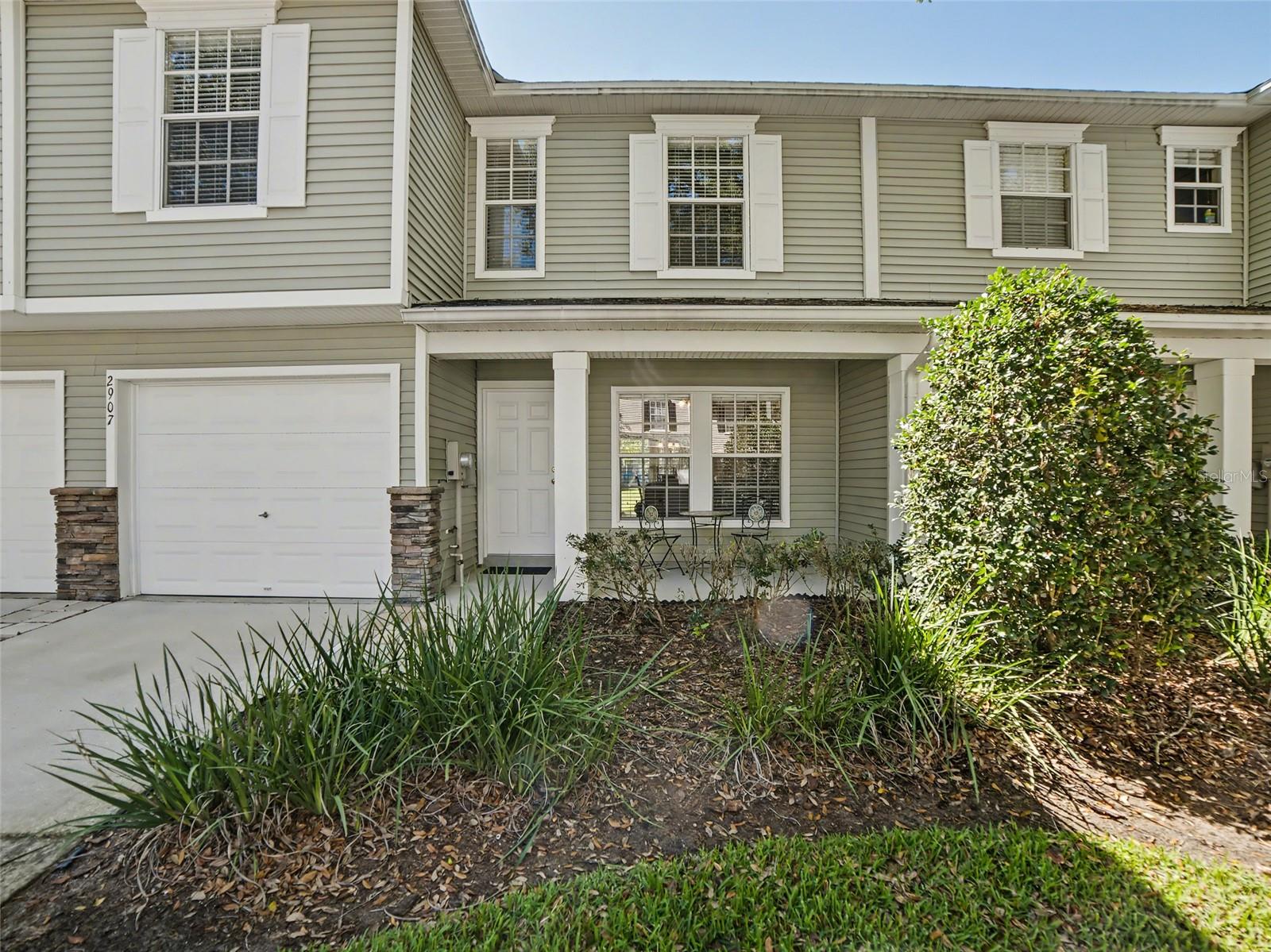Exquisite Luxury Townhome in Oakwood Terrace – Valrico

Experience refined Florida living in this impeccably maintained three-bedroom, two-and-a-half-bath luxury townhome, ideally situated within the highly sought-after Oakwood Terrace community in Valrico. Blending timeless elegance with modern comfort, this residence offers a sophisticated yet inviting atmosphere along picturesque, tree-lined streets.

A charming front porch sets the tone for relaxed, upscale living, creating an inviting space to enjoy peaceful mornings or unwind with an evening cocktail. Inside, a thoughtfully designed open-concept floor plan is bathed in natural light, offering seamless transitions between the living, dining, and entertaining spaces. The kitchen serves as the heart of the home, beautifully appointed with rich maple cabinetry accented by crown molding, sleek Corian countertops, a spacious pantry, and an elevated breakfast bar that is perfect for both casual dining and hosting guests. Its open design overlooks the expansive living and dining areas, enhancing both flow and functionality.

Sliding glass doors lead to a private rear patio overlooking tranquil conservation and serene pond views, offering a peaceful natural backdrop and a true sense of retreat. The owner’s suite is privately positioned to capture these calming views, creating a serene escape at the end of the day. The en-suite bath features a walk-in shower and refined finishes designed to provide both comfort and understated luxury.

Upstairs, a versatile loft adds flexibility to the home, ideal for a private office, study, or additional lounge space. Throughout the residence, thoughtful upgrades and design details enhance the overall aesthetic, including ceramic tile flooring in the main living areas, maple cabinetry carried throughout the kitchen and bathrooms, designer nickel lighting fixtures, ceiling fans, modern black hardware, and classic six-panel interior doors. A well-appointed secondary bathroom offers a tub and shower combination, while the powder room features a full cabinet vanity with sink.

Completing the home is a one-car garage and a charming Craftsman-style exterior that enhances its curb appeal. Residents of Oakwood Terrace enjoy a truly low-maintenance lifestyle with HOA services that include lawn care, landscaping, water, sewer, and trash, along with access to a beautifully maintained community pool. The neighborhood is both family- and dog-friendly, offering a welcoming environment to relax and enjoy the Florida sunshine.

Ideally located just minutes from Tampa, this exceptional residence provides convenient access to premier dining, shopping, major highways, and Tampa International Airport, as well as Florida’s world-renowned Gulf Coast beaches, making it a perfect blend of luxury, comfort, and convenience. LOW HOA Fee's and No CDD Fee's.