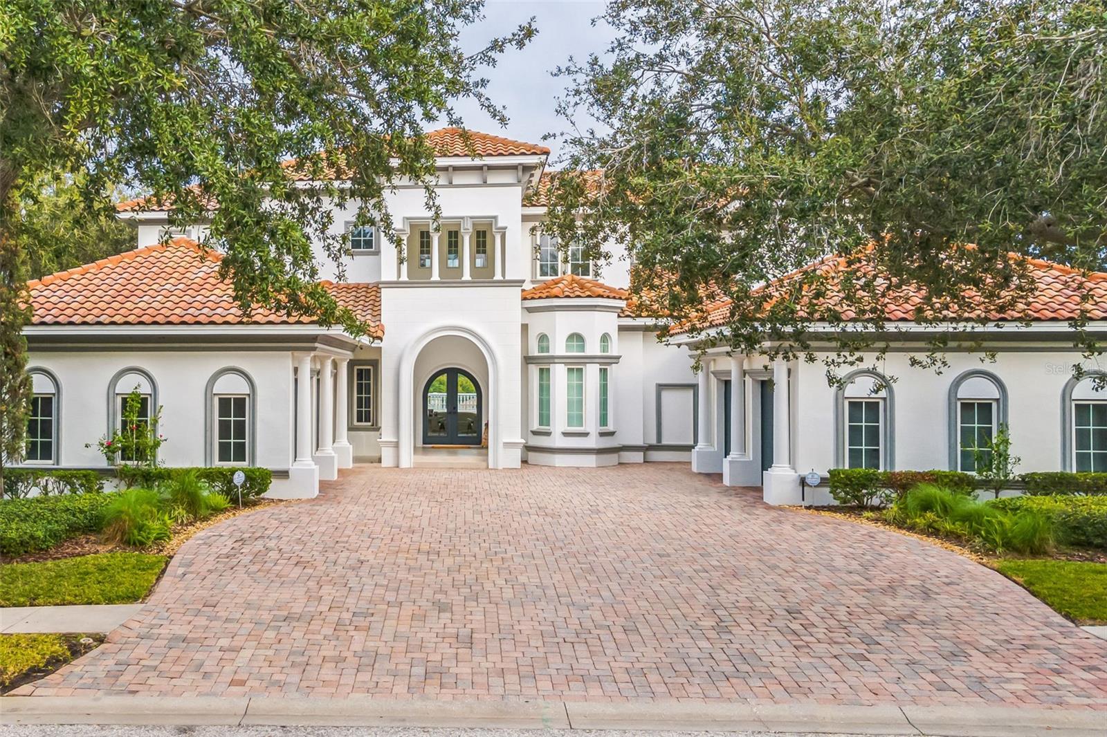 Welcome to a paradisiacal retreat nestled within the prestigious confines of Palm Harbor's gated community (HIGHLANDS OF INNISBROOK). This opulent villa spans an impressive 6,017 SF and offering an unparalleled vista overlooking the revered golf course, a gem of the professional circuit. This estate underwent a comprehensive renovation. Impeccably redesigned with the finest materials and cutting-edge amenities, the residence exudes an aura of sophistication and modernity, seamlessly intertwined with its original charm. Entertainment reaches new heights with a bespoke private cinema room, meticulously designed for unparalleled viewing experiences. Complete with a dedicated space for popcorn and beverages, it promises immersive entertainment for family and friends.
Indulge in a multitude of amenities offered within the community, including a lavish spa, fully-equipped gymnasium, tennis courts, multiple pools with slides and spas, and delectable dining options, ensuring a resort-like lifestyle within arm's reach. This exceptional property is a harmonious fusion of modernity, technology, and timeless elegance. Immerse yourself in the lap of luxury and embrace the serenity this haven offers for your family.  Call today for a private showing!