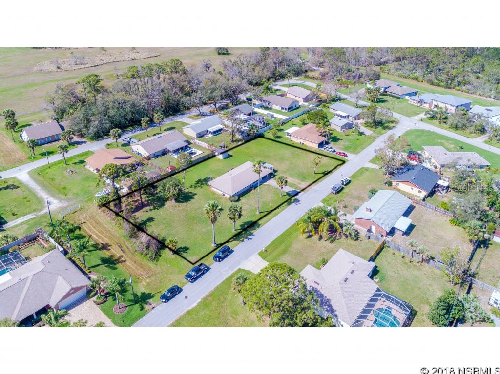 Charming 3 bedroom 2 bath home positioned on 3/4 of an acre. The home has newer flooring throughout and updated bathrooms. The kitchen has new stainless appliances in 2017 that were only used for 6 weeks. The new in 2017 washer & dryer only used for 6 weeks stay too. The roof and water heater are new in 2012. Enjoy one of the biggest yards in Florida Shores! One parcel but could possibly be divided into two additional 80 x 125 buildable lots. Home includes lightning mitigation system on roof. This home is a must see! ;Water: City