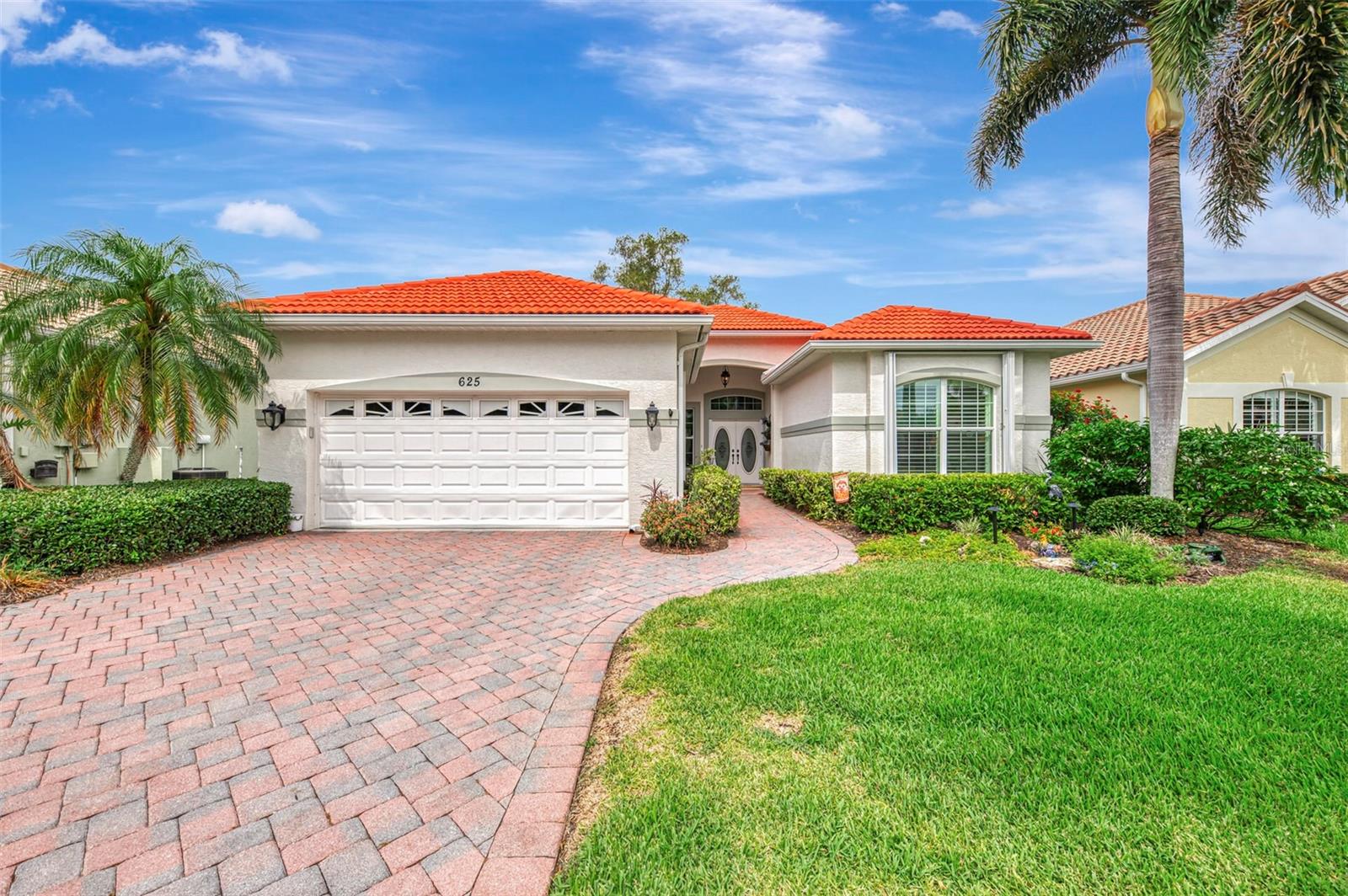 This wonderful home in the desirable Sawgrass Community is a special find! Over 2000 square feet with 2 bedrooms and a den, in the maintenance free neighborhood where lawn care, mulching and pruning are all taken care of, making ownership abit easier. This lovely floorplan was built by J&J Homes who is known for quality, superb features with high ceilings, crown moldings and timeless design. The island kitchen has been remodeled with endless counterspace, aquarium window and spacious eat-in area. The primary bathroom was remodeled with quartz countertops, dual sinks, soaking tub and walk-in shower. The second full bath has been remodeled as well. The HVAC was replaced in 2022 with a 2 zones system! Brand new hot water heater in 2026. The new lanai cage was installed in 2025. As you enter the double front doors the open floor plan captures your eye with the dining room, great room and kitchen embracing one another which is perfect for family gatherings and entertaining. There is a study with French doors for privacy along with a guest bedroom and full bath for your overnight guests. The primary bedroom is spacious with a large walk-in closet and luxurious bath. The spacious lanai is nestled with a beautiful tree and lovely plantings overlooking the golf course. This home is equipped with high impact tinted windows along with accordion shutters. There is a filtered water system and security system. The roof also was Perma Sealed in 2014. Sawgrass is a fabulous community with a lovely clubhouse, community pool, fitness center and pickleball courts. There is a wonderful social calendar for the residents too. This is a golf community where golf is NOT mandatory and there is no CDD and low HOA fees. Located within minutes to downtown Venice, beaches, restaurants and so much more!
