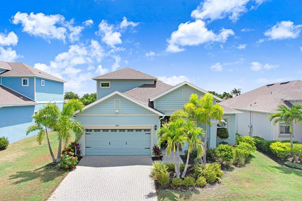 Dockable Lot! Welcome to 5425 Wishing Arch Drive, a stunning waterfront residence located within the resort-style gated Mirabay community of Apollo Beach. Offering an exceptional blend of luxury, comfort, and the sought-after Florida waterfront lifestyle, this beautifully designed home invites you to experience where every day feels like a vacation.

Featuring 3 bedrooms, 3 full bathrooms, and a spacious upstairs loft, this thoughtfully designed floor plan offers exceptional flexibility and functionality. The expansive loft provides a secondary living area with ample space for a home office, media room, fitness area, playroom, or potential conversion to an additional bedroom, creating the opportunity for a potential 4-bedroom layout. The generous primary suite offers room for large furnishings, while the open-concept living, dining, and kitchen areas create a warm and inviting atmosphere for entertaining and everyday living.

Step outside and discover your own private waterfront retreat. Wake up to tranquil water views, spend afternoons on the water, and unwind with beautiful Florida sunsets from the comfort of your own backyard. The backyard offers abundant space for outdoor enjoyment and presents an excellent opportunity for a future pool, allowing you to create the outdoor oasis you've always envisioned. Boating enthusiasts will appreciate the private dock located directly behind the home, providing convenient access to Tampa Bay and the Gulf of Mexico for boating, fishing, paddleboarding, kayaking, and endless waterfront adventures.

As a resident of MiraBay, you'll enjoy an impressive collection of resort-style amenities, including a clubhouse, community pools, fitness center, tennis and pickleball courts, parks, playgrounds, walking trails, and vibrant community events throughout the year. 

Selected furnishings may be available for purchase separately. Whether you're searching for a year-round residence, seasonal getaway, or waterfront lifestyle upgrade, this remarkable home offers an opportunity to enjoy resort-style living.