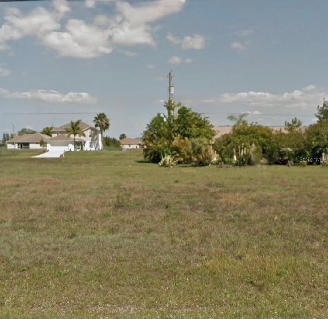 ATTENTION INVESTORS, BUILDERS, AND FUTURE HOMEOWNERS! RARE DUPLEX LOT IN WEST-CENTRAL CAPE CORAL!
Welcome to 1313 Nelson Rd N, a spectacular 0.23-acre (10,019 sq. ft.) vacant parcel that represents the perfect canvas for your next real estate project. Comprising Lots 3 & 4 (Cape Coral Unit 38 Blk 2653), this oversized lot features 80 feet of road frontage and a depth of 125 feet, offering ample space for modern architectural designs, multi-car garages, and custom outdoor living areas.  ZONED RD-D (RESIDENTIAL DUPLEX): Finding affordable duplex lots in Cape Coral is becoming increasingly rare. This premium zoning maximizes your investment potential. Build a duplex to generate dual rental income, create a multi-generational family compound, or construct a sizable single-family residence with room for a pool and a tropical oasis.
NO HOA OR CDD FEES: Enjoy the freedom of owning land without the hassle of restrictive bylaws, monthly association dues, or strict architectural committees. Build on your own schedule with the builder of your choice.
READY FOR DEVELOPMENT: The property is located on a fully paved, well-maintained road (Nelson Rd N). Public water utilities are available in the immediate area, simplifying the pre-construction permitting process.