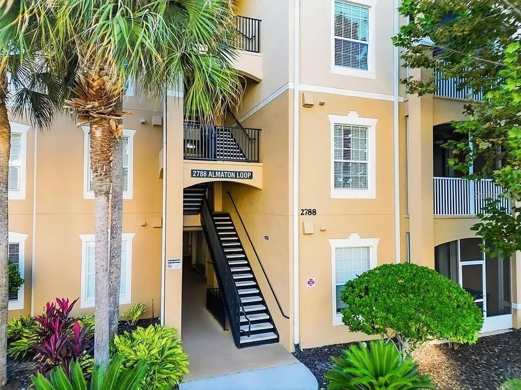 Located in the beautiful resort community of Windsor Hills just minutes from Disney. This spacious 2-bedroom, 2-bathroom condo comes fully furnished and is currently being used for short-term rental. Turnkey condo is in the perfect 2nd floor location, New AC (August 2024) and water heater (March 2025) ready for short-term rentals with opportunity to transfer management and bookings already in place.  The Windsor Hills Resort is a 24-hour guard gated community with amazing amenities such as a large resort “beach entry style” pool and waterpark with a waterslide and splash pad.  The large clubhouse includes a fitness center, theatre and game rooms, welcome center and Sundry Shop.  The resort amenities also include outdoor tennis courts, basketball court and picnic/grill area, all adjacent to this condo building.  Association fees include water, high-speed Internet, cable TV, trash service and 24-hour resort security. Located just 2.5 miles from the Disney entrance and extremely close to dining, shopping and entertainment don’t miss out on this opportunity!!