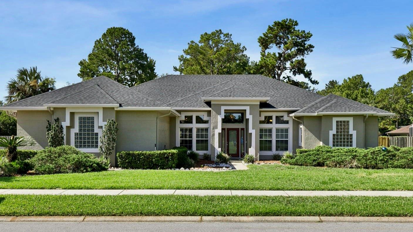 Wow…half an acre in Lake Mary featuring 3 bedrooms/3 full baths and a separate dedicated office complete with office furniture (or 4th bedroom), is waiting for the buyers who want to bring their own style and vision to a solid, well maintained property.  The popular Florida “split plan” with two bedrooms on one side and the primary retreat and office on the other side allows for privacy galore. Guests enter the front door to a spacious living area that overlooks a sparkling screened pool. Hard surface flooring throughout most of the home allows for easy maintenance.  An open kitchen with granite counters overlooks a large family room that features a wood burning fireplace for those cooler months.  French doors lead out to the lanai and pool area from all the main living areas and there is a pool door in the guest bathroom to allow swimmers inside access without going through the main areas.  Brand new roof (2026), new exterior painting (2026) and new water heater (2026) will all keep property insurance in check..  Don’t miss this once in a lifetime deal.
