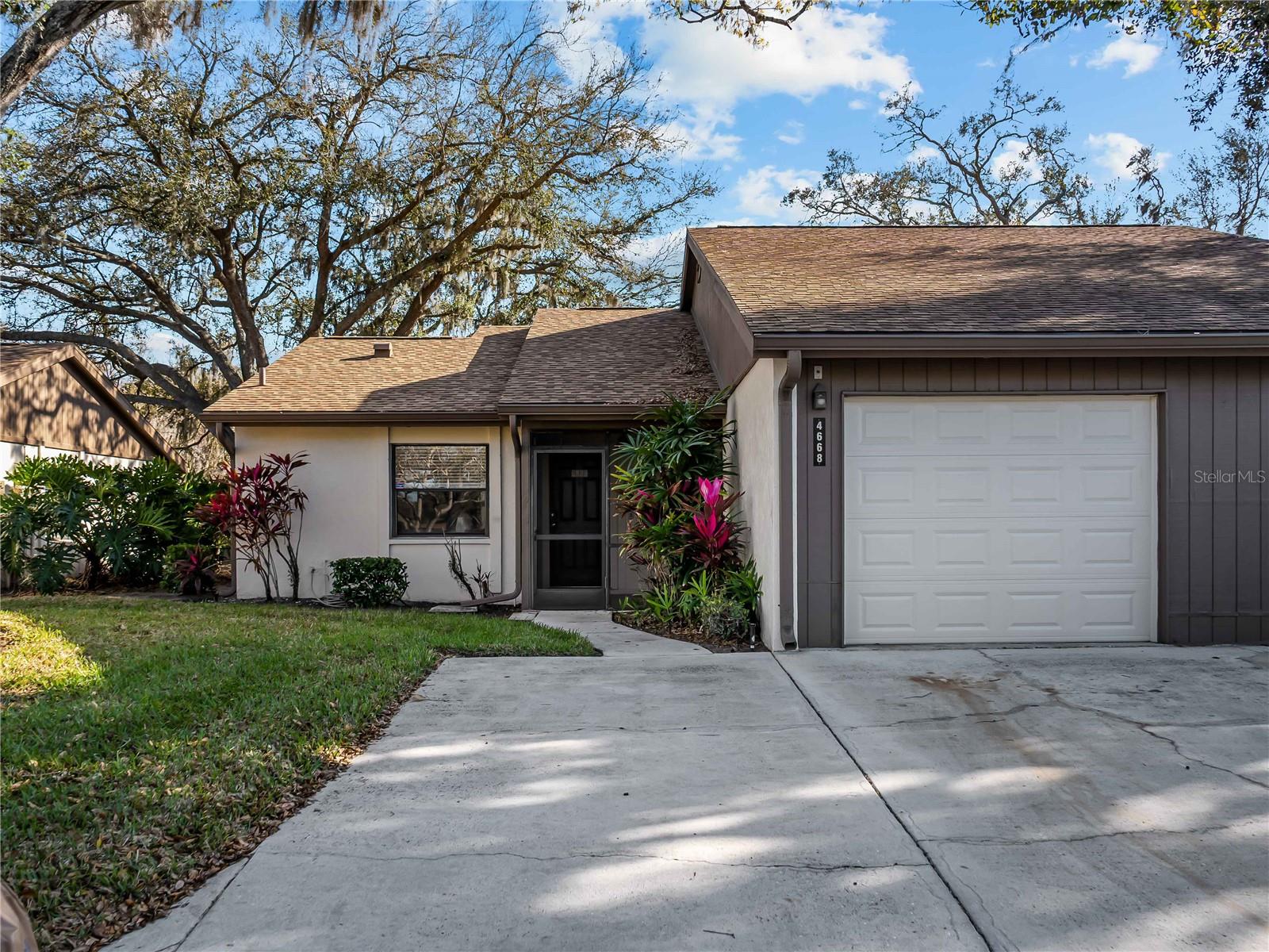 Your Private Sarasota Sanctuary Awaits!  Discover true Florida living in this beautiful end unit villa situated on a quiet street. This 2 BR/2BA gem located in the Village Oaks Community is a breath of fresh air.  Enjoy morning coffee on your screened front porch or sunsets drinks on the large rear lanai.  Inside, the home features vaulted ceilings in living/dining areas and luxury vinyl plank flooring flowing throughout the main living space and bedrooms.  The split-bedroom floor plan ensures maximum privacy for owners and visitors alike.  The bright kitchen features stainless appliances and an eat-in nook filled with natural light. Best of all, the community pool and tennis court are just steps away from your front door! Perfectly located near UTC shopping and beautiful beaches nearby - this is the Florida lifestyle you've been searching for!